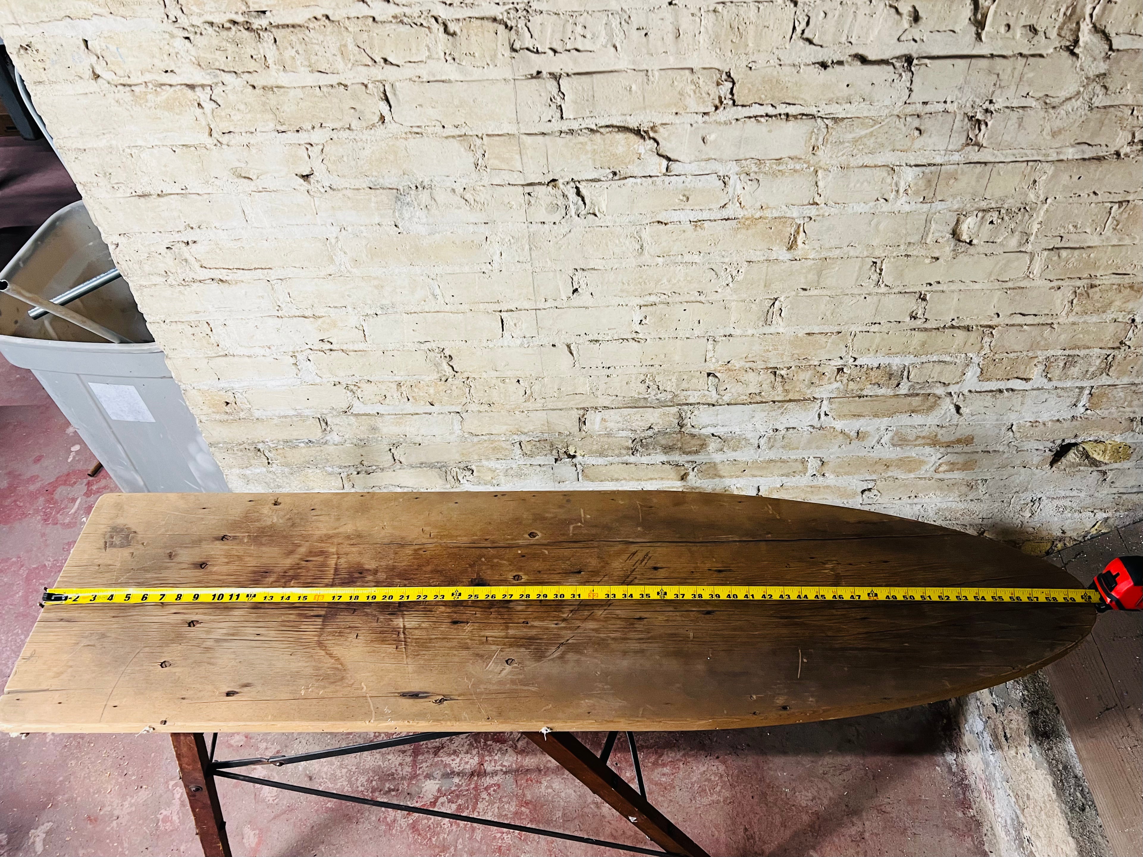 Vintage wooden folding ironing board.