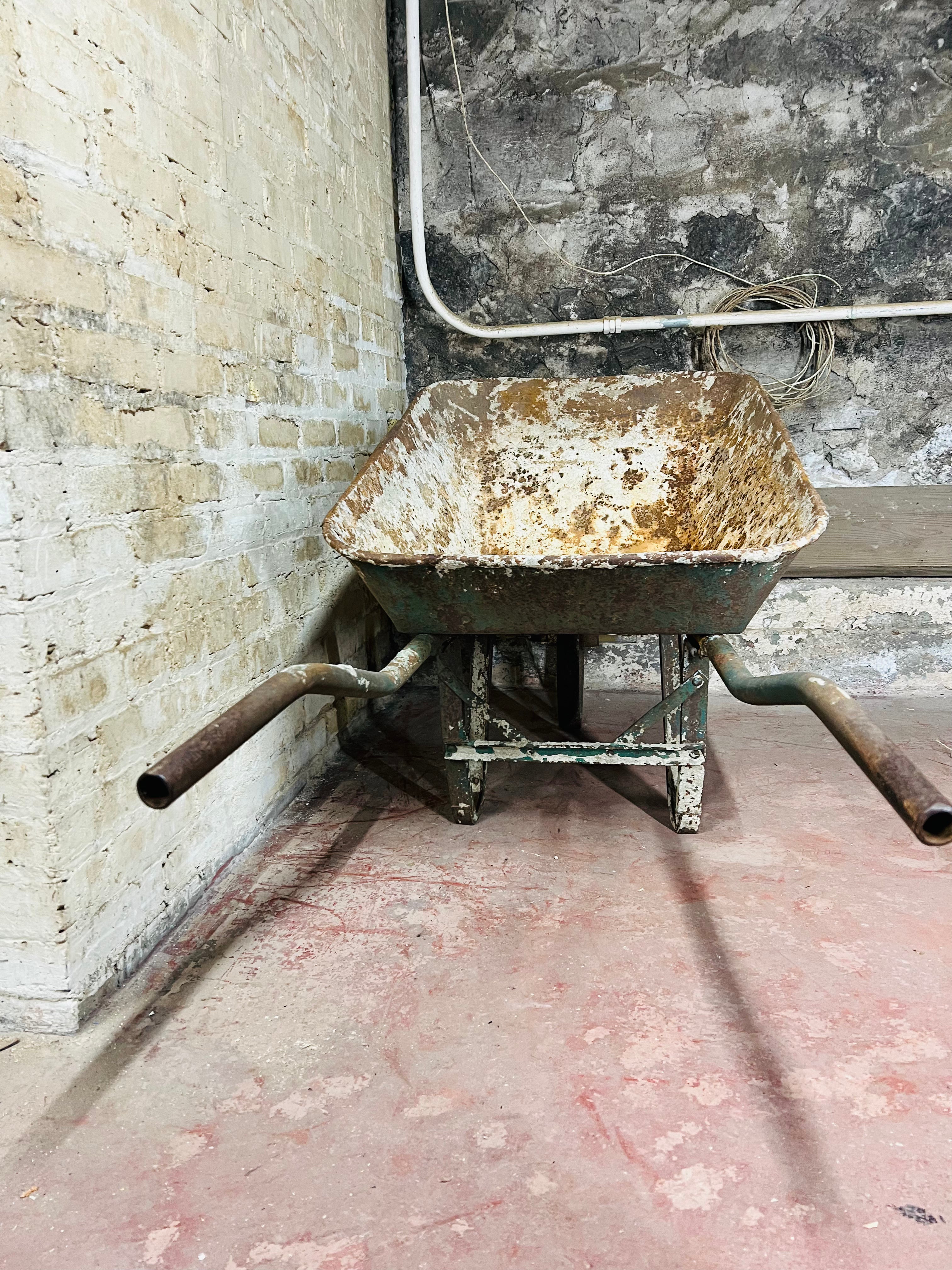 Vintage all metal wheelbarrow.