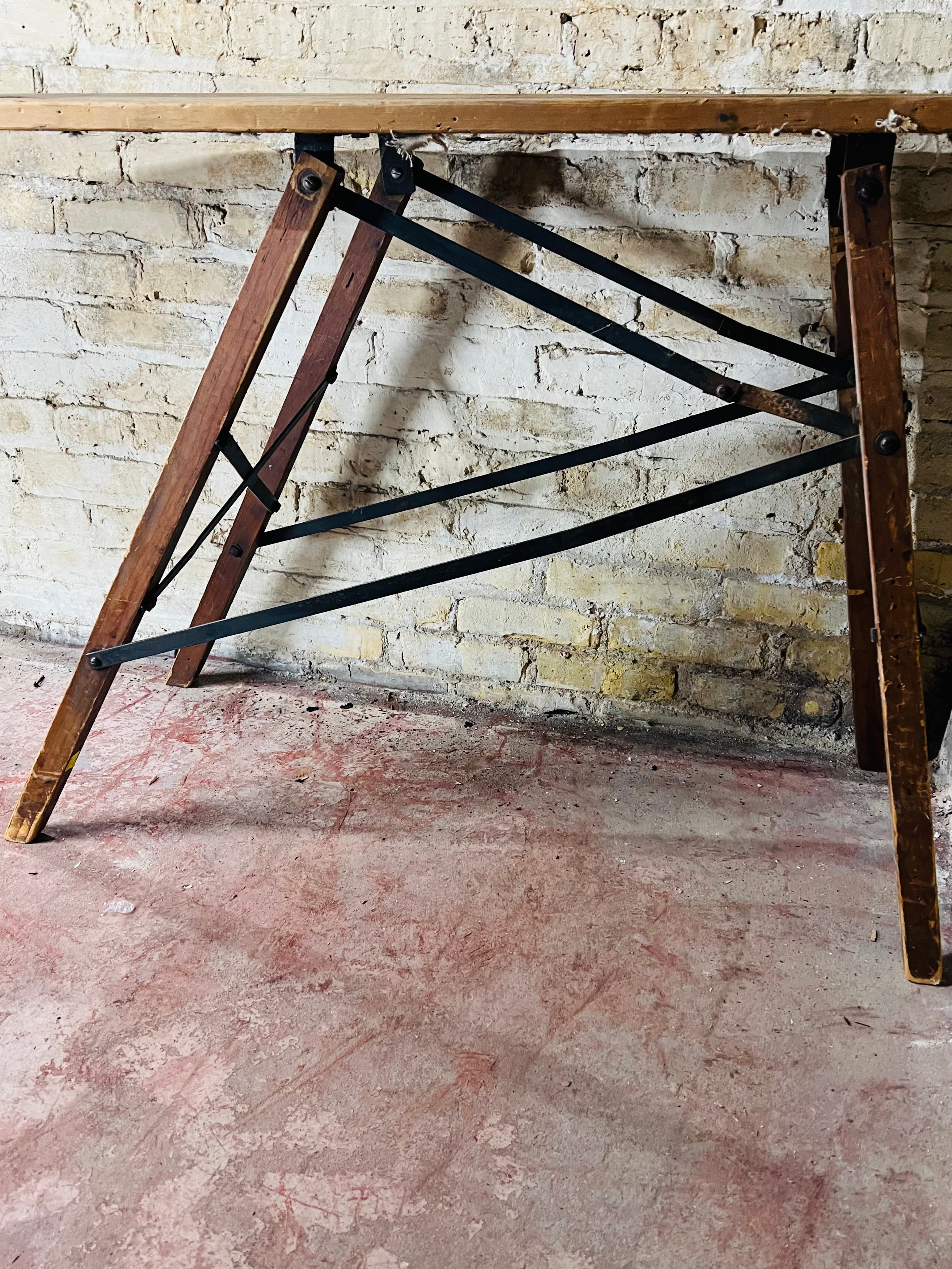 Vintage wooden folding ironing board.