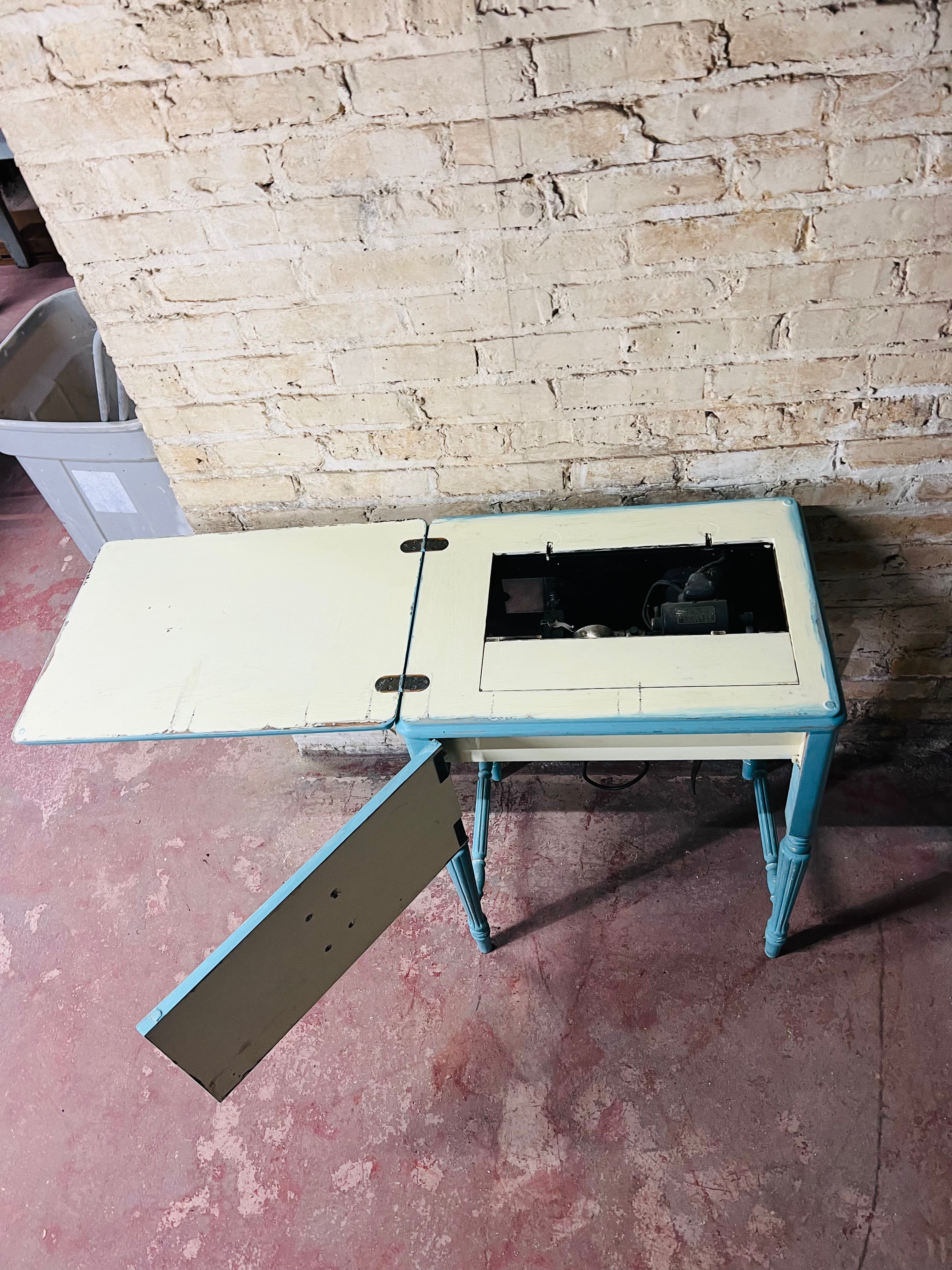 Vintage Kenmore sewing machine with antique cabinet. Good working order.