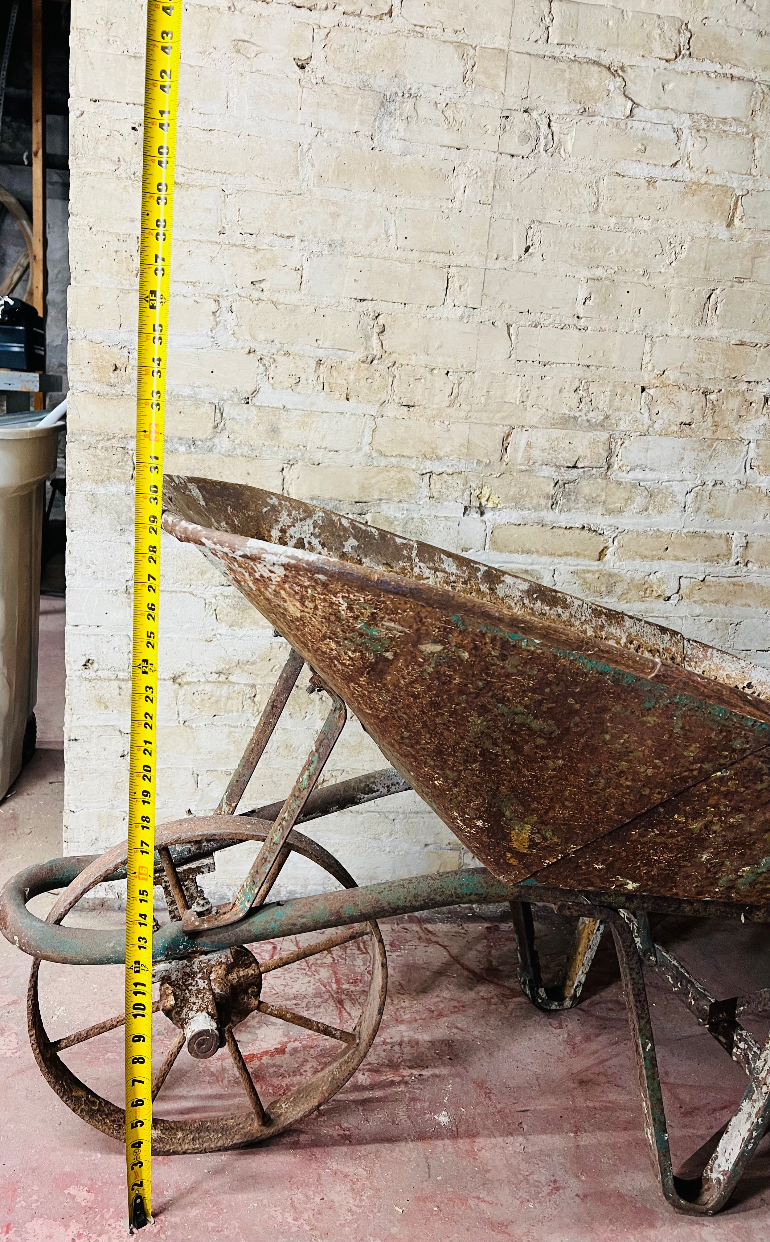 Vintage all metal wheelbarrow.