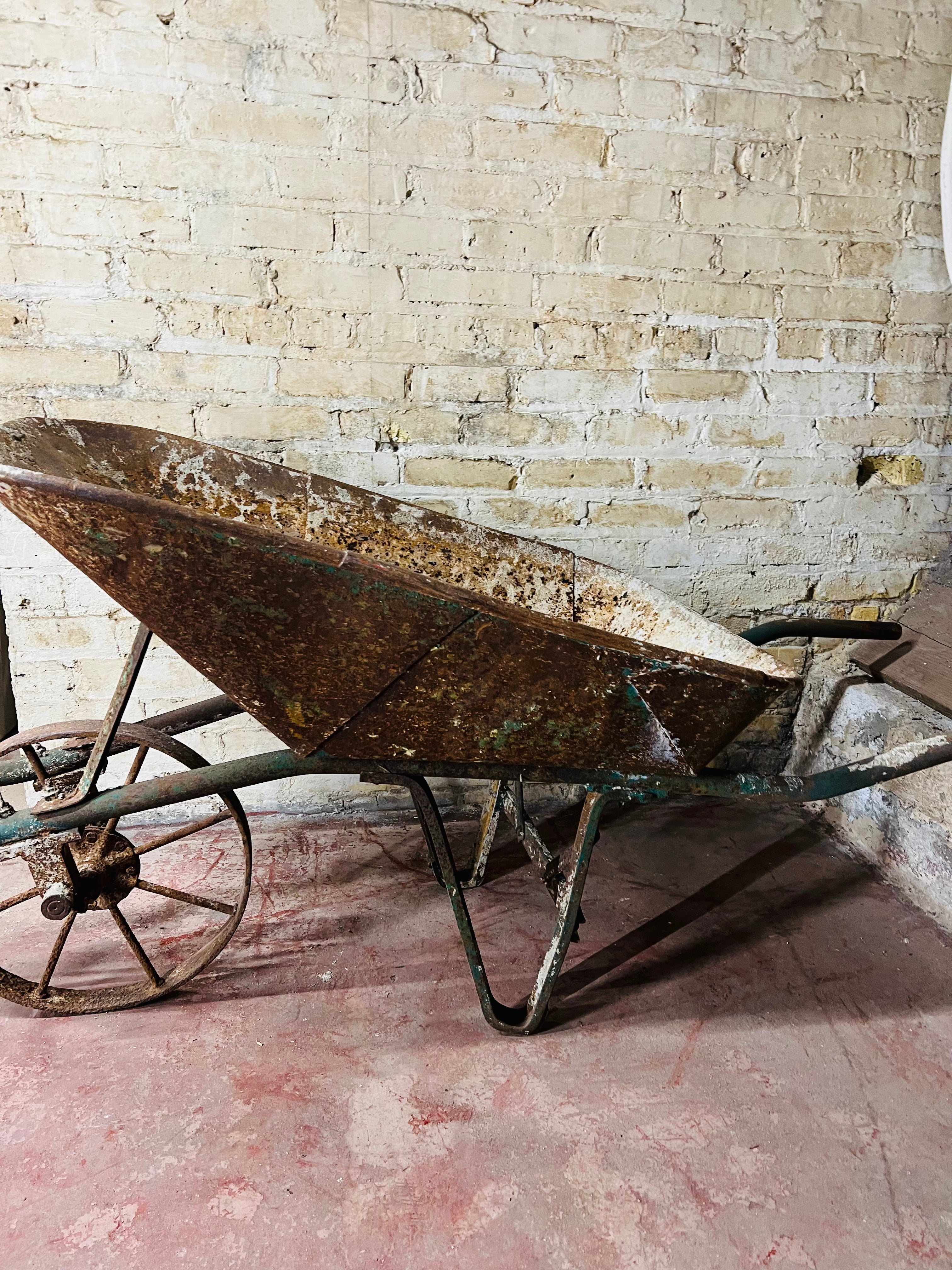 Vintage all metal wheelbarrow.