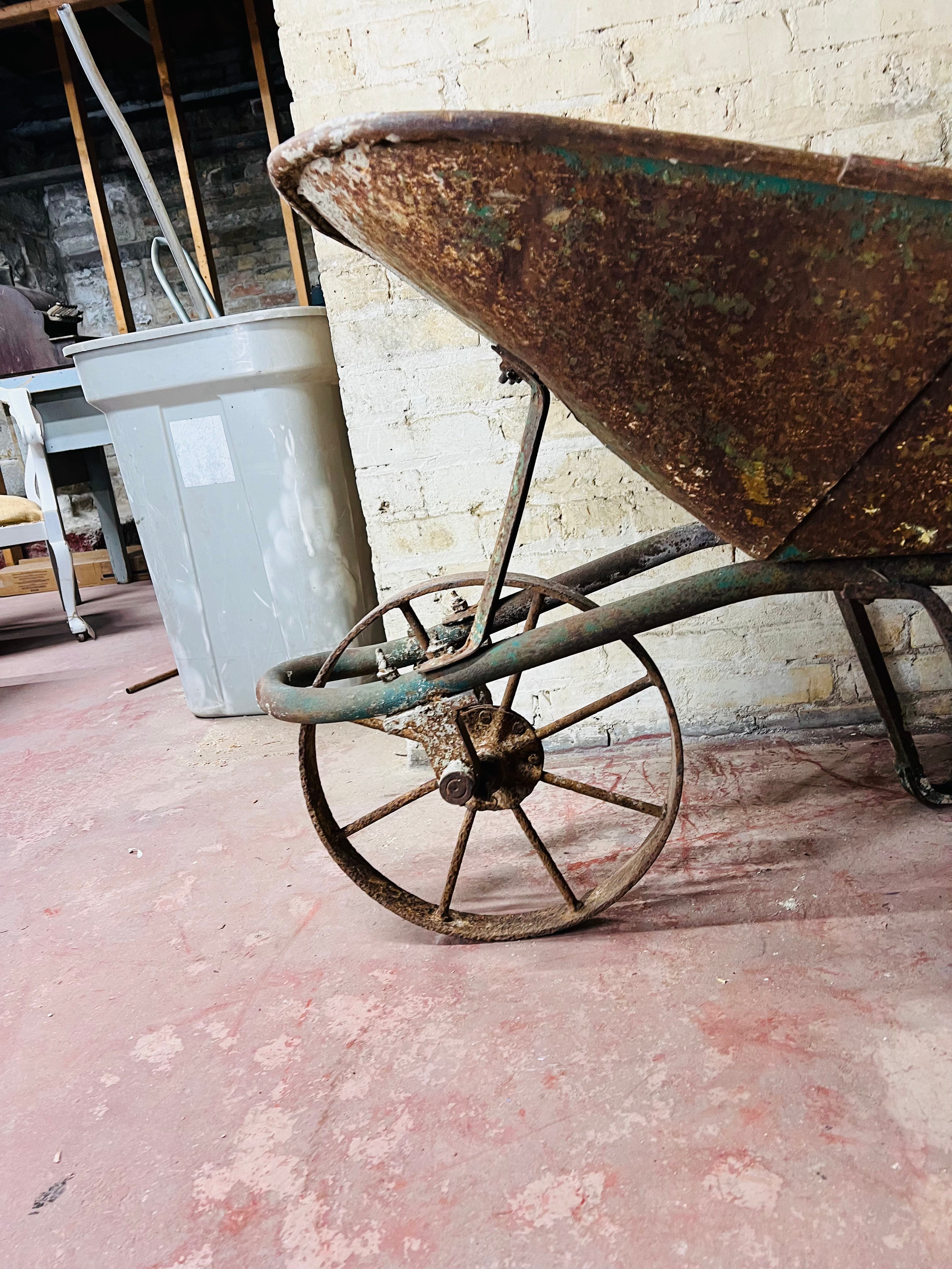 Vintage all metal wheelbarrow.