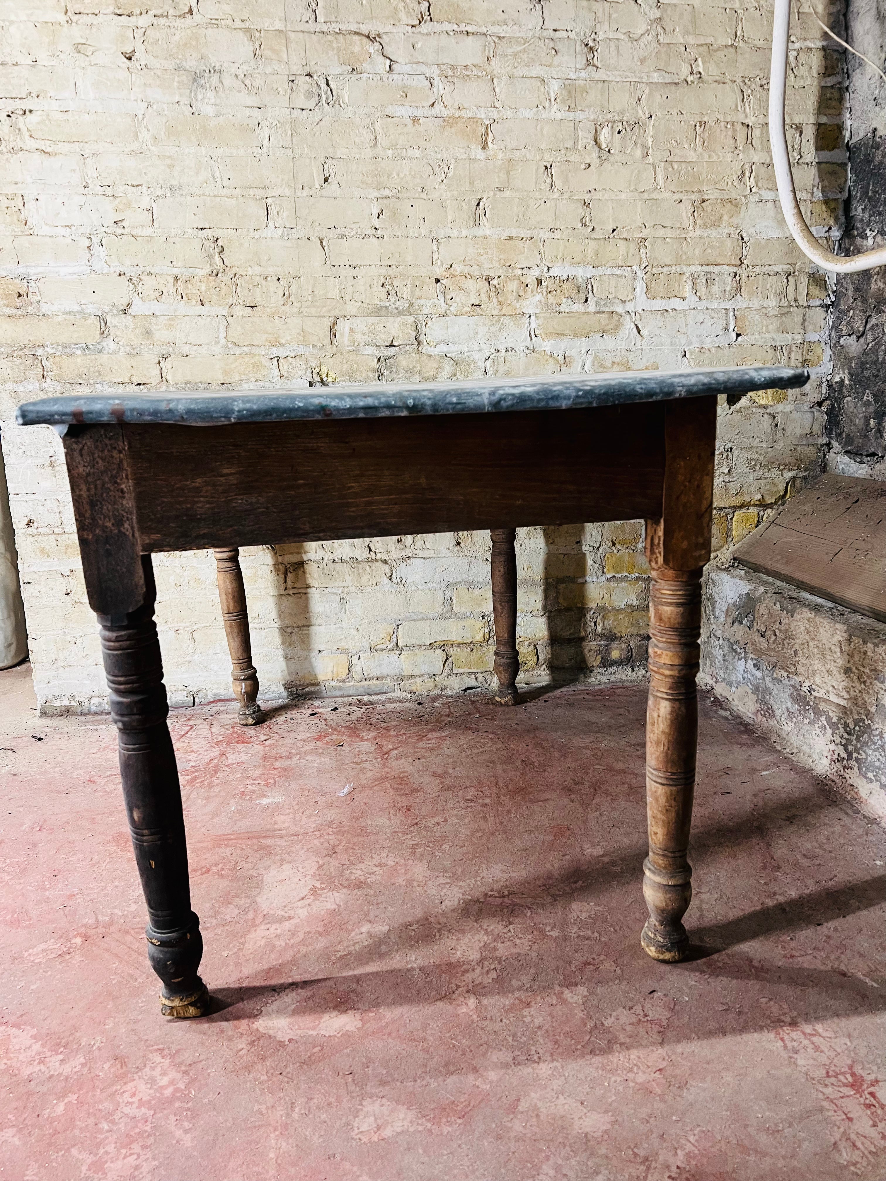 Vintage farm table with zinc top missing drawer.