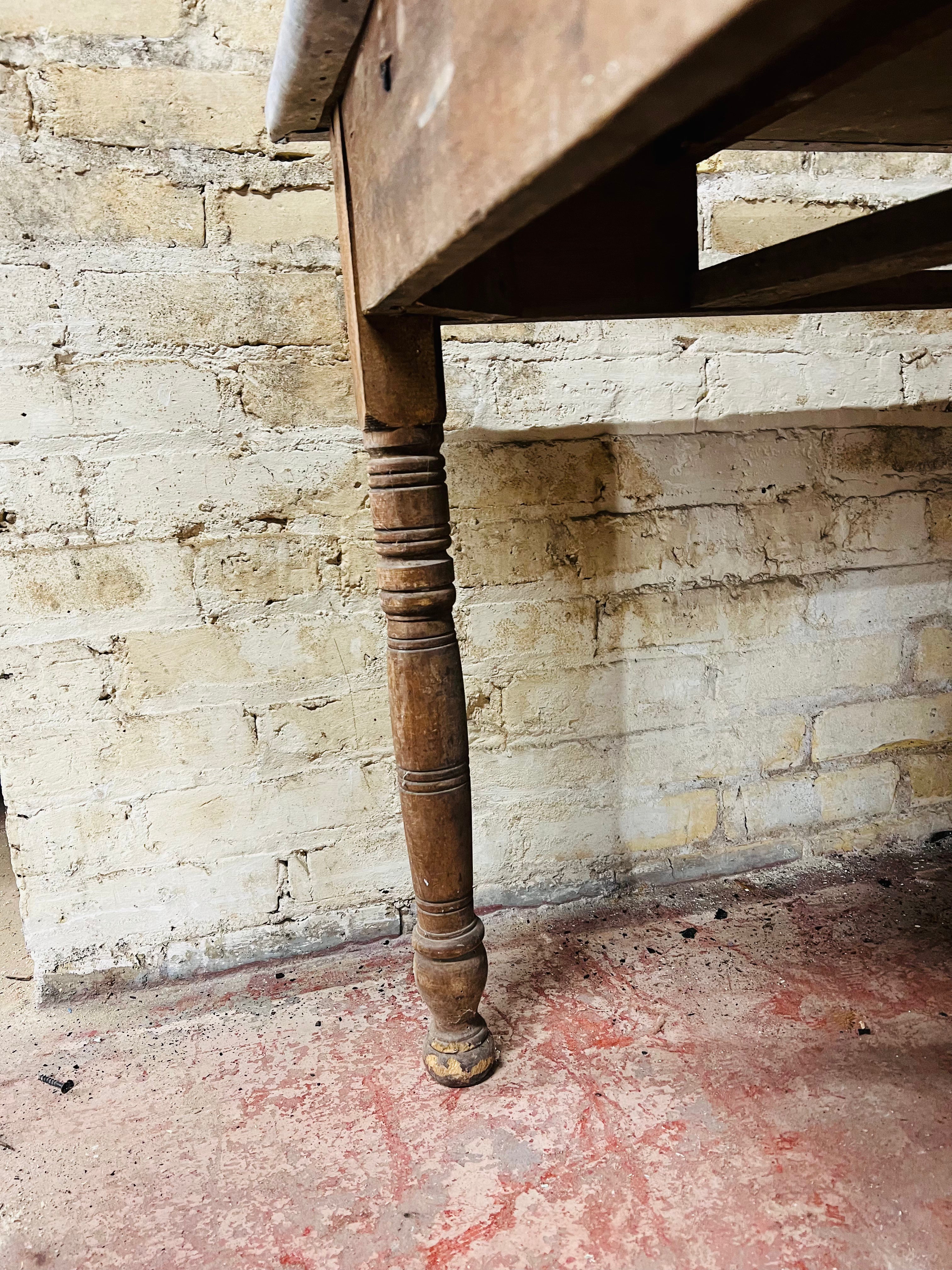 Vintage farm table with zinc top missing drawer.