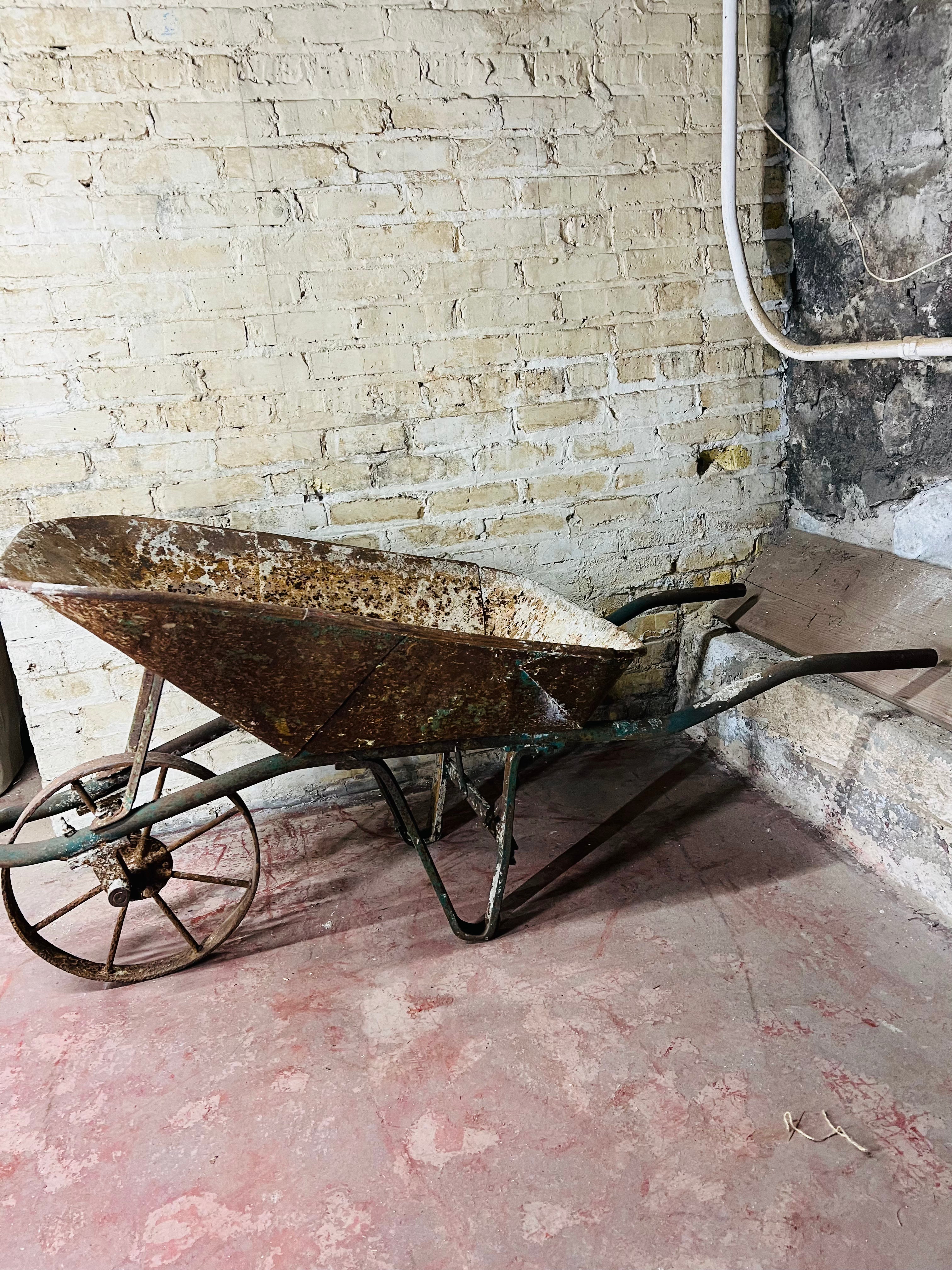 Vintage all metal wheelbarrow.