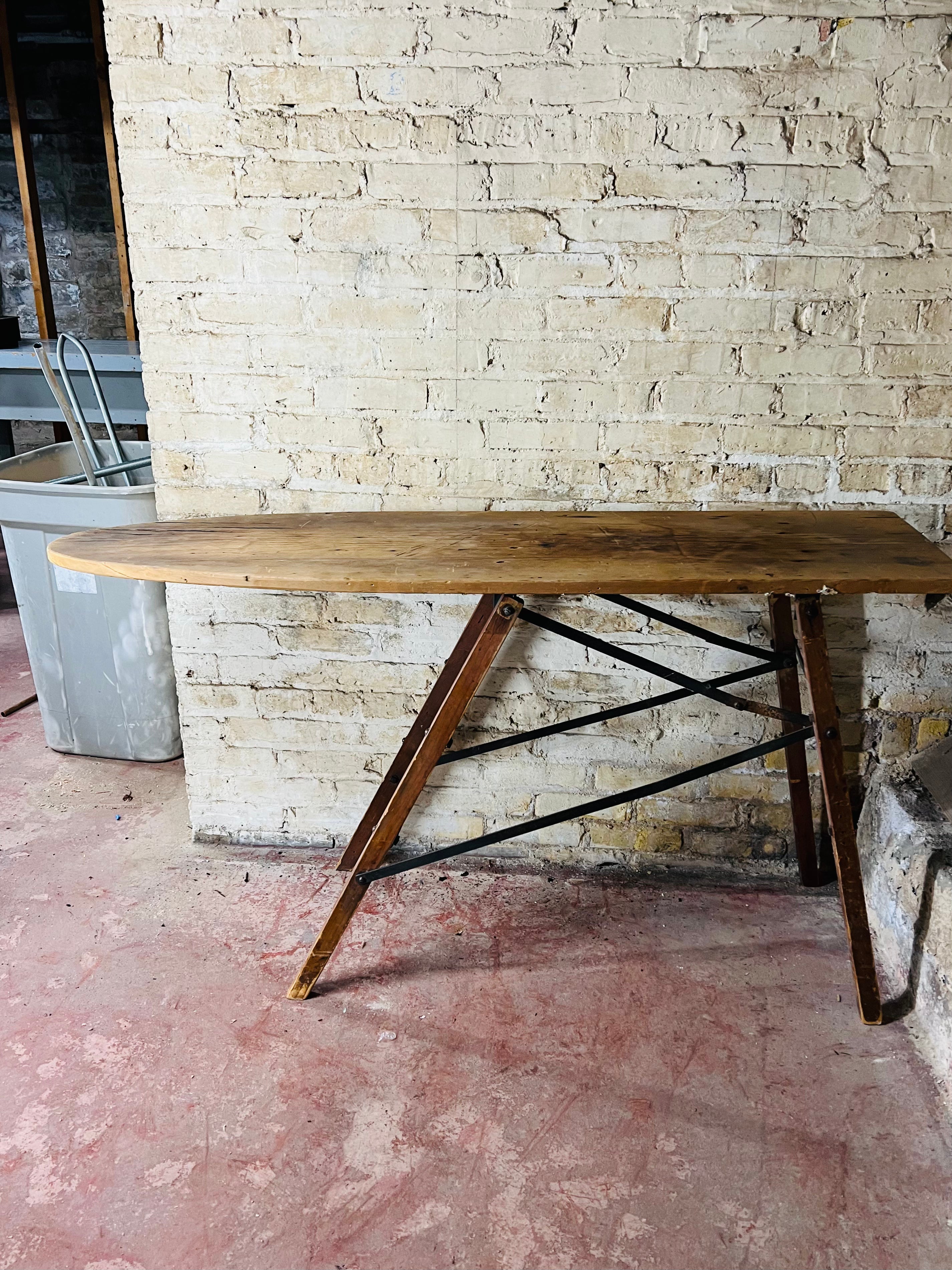Vintage wooden folding ironing board.