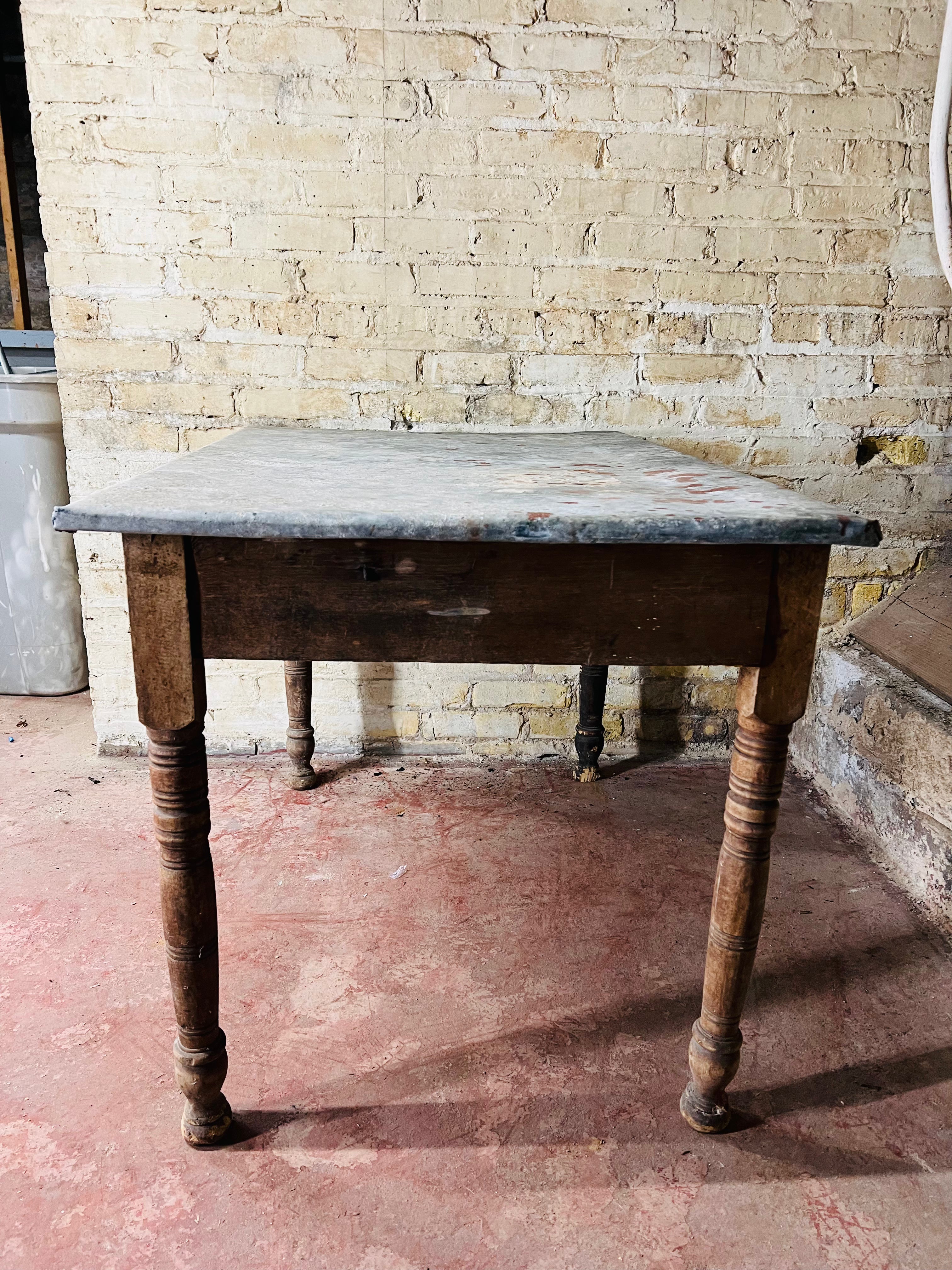 Vintage farm table with zinc top missing drawer.