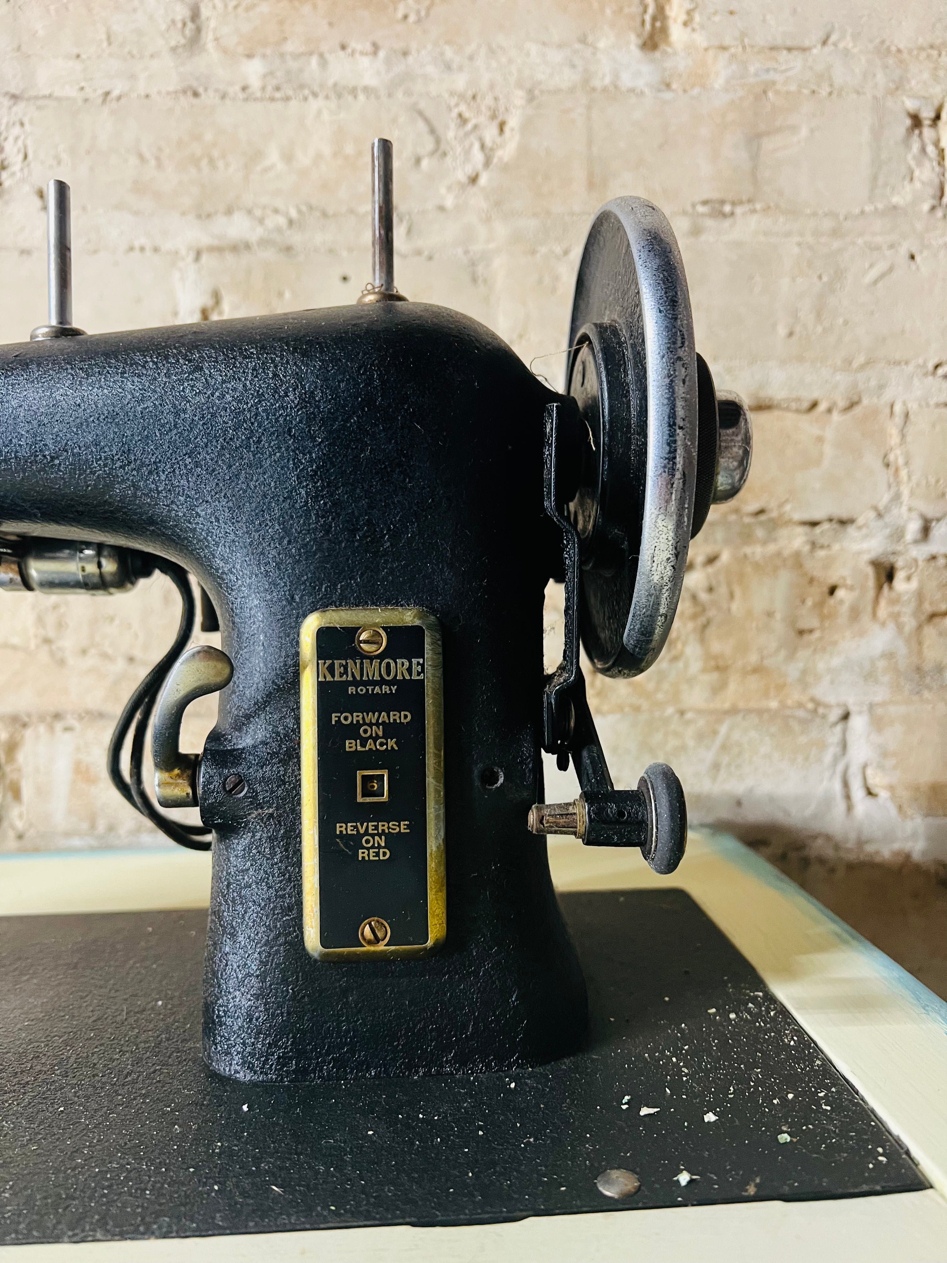 Vintage Kenmore sewing machine with antique cabinet. Good working order.