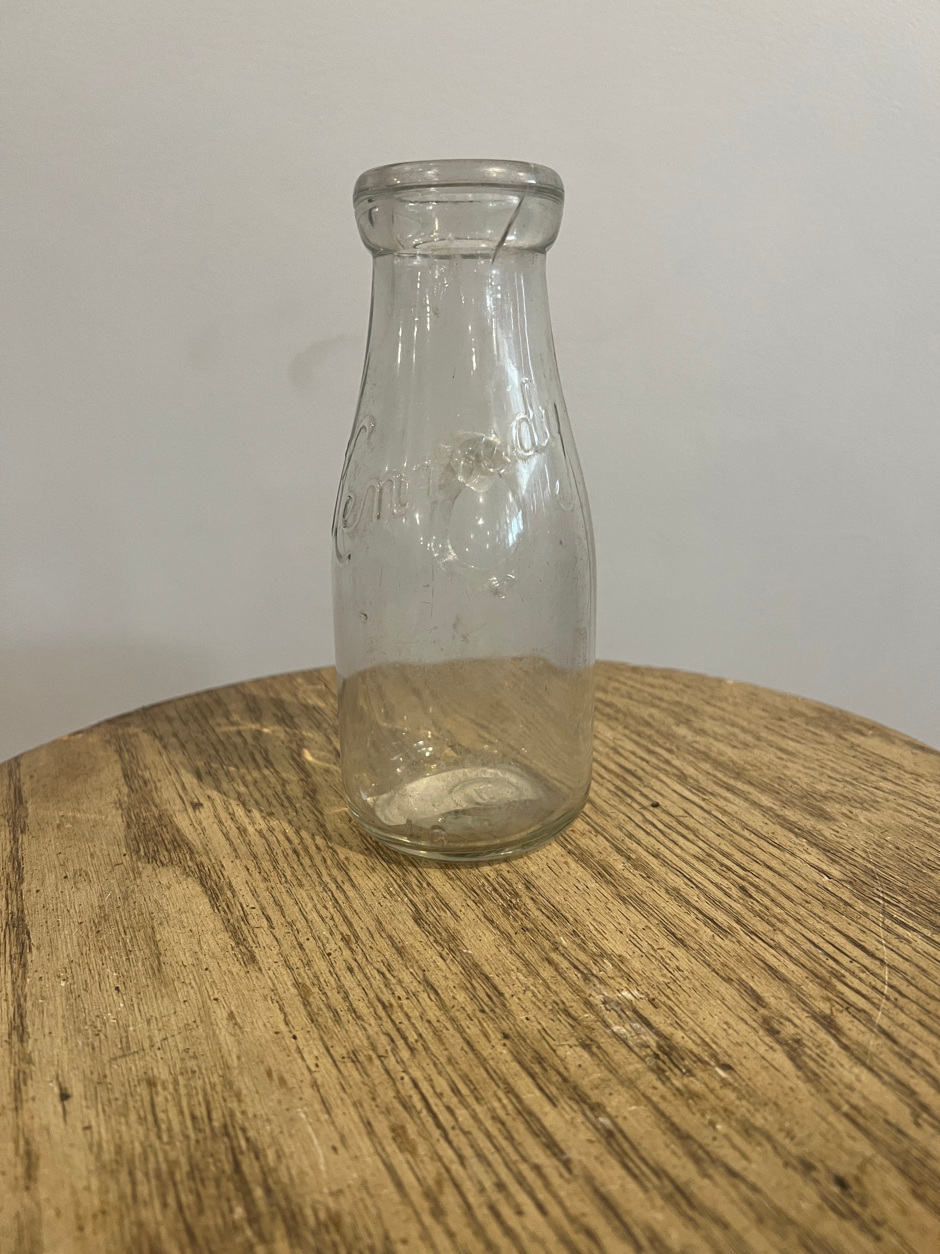 Antique glass milk bottle