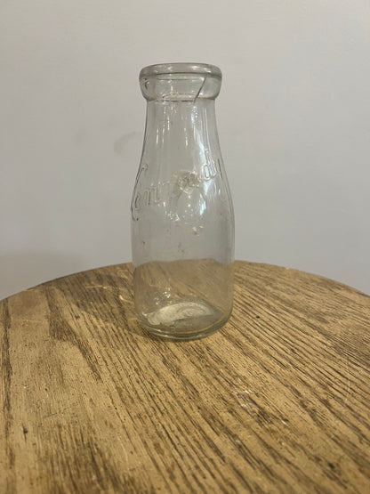 Antique glass milk bottle