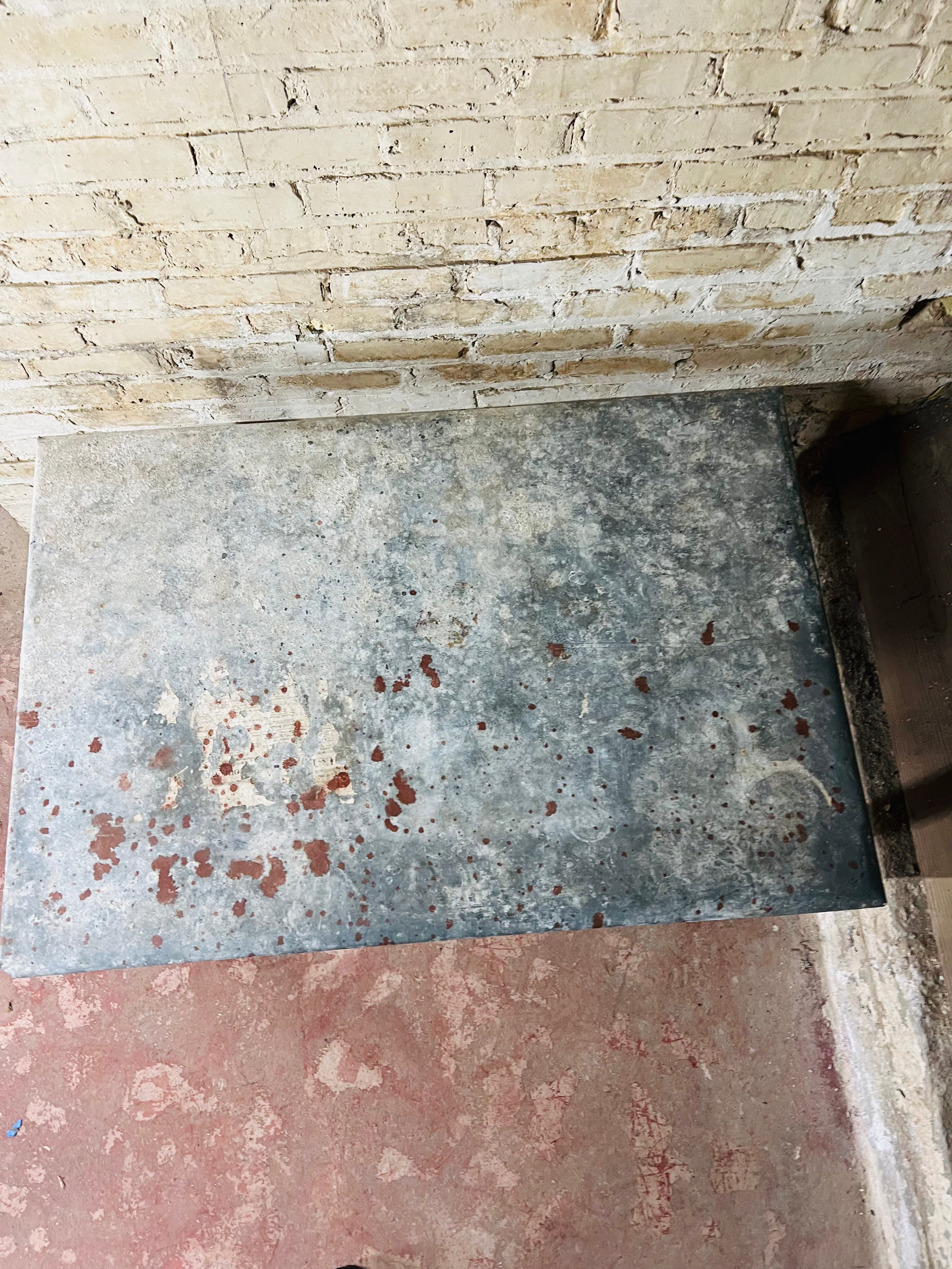 Vintage farm table with zinc top missing drawer.