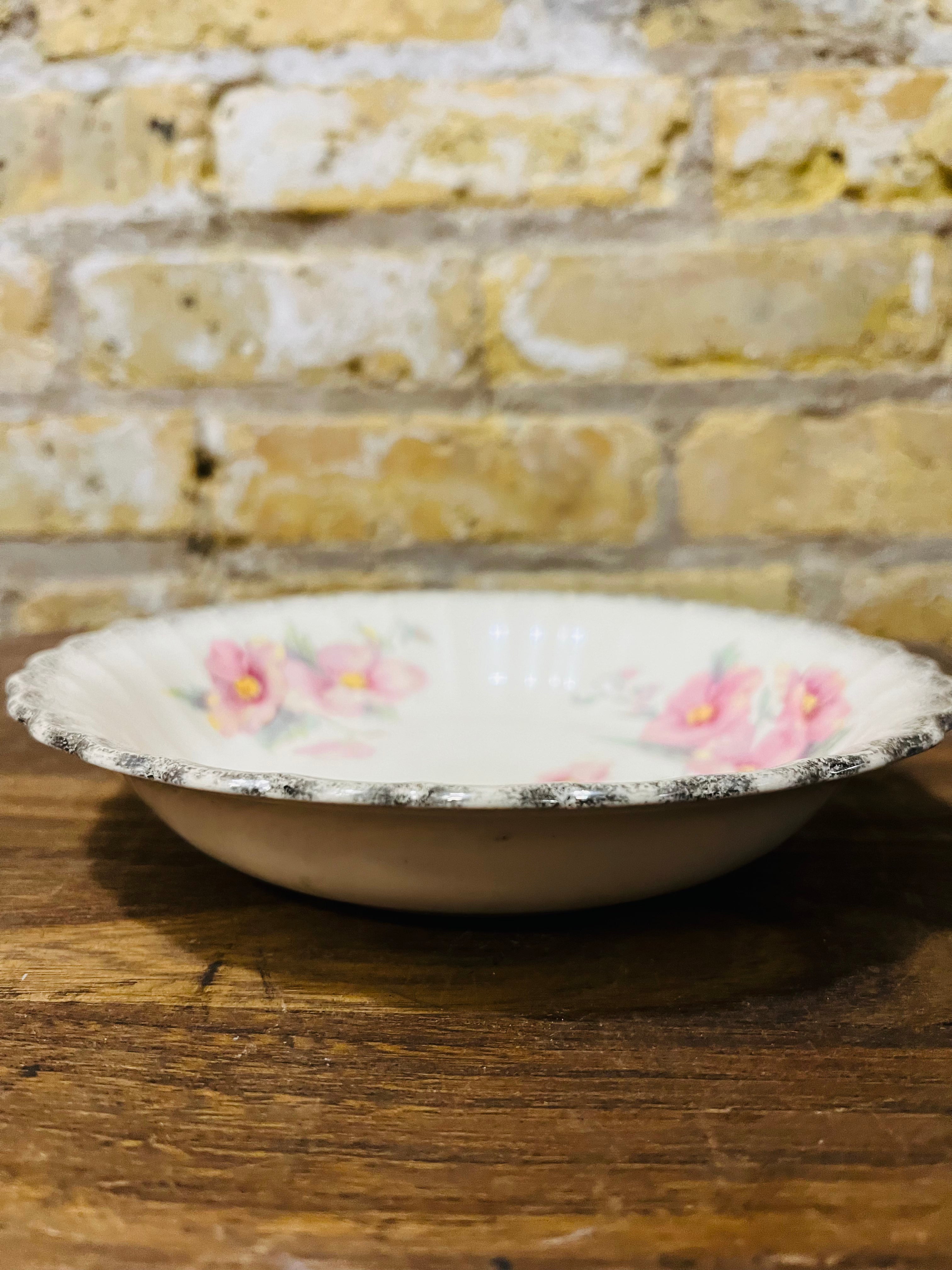 Vintage Sebring ivory porcelain bowl colored flower design.