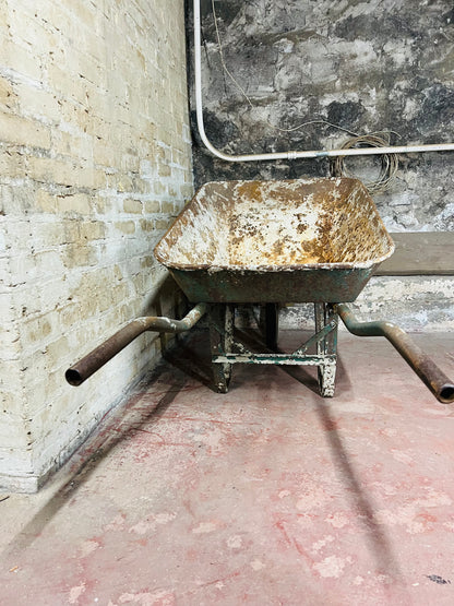 Vintage all metal wheelbarrow.