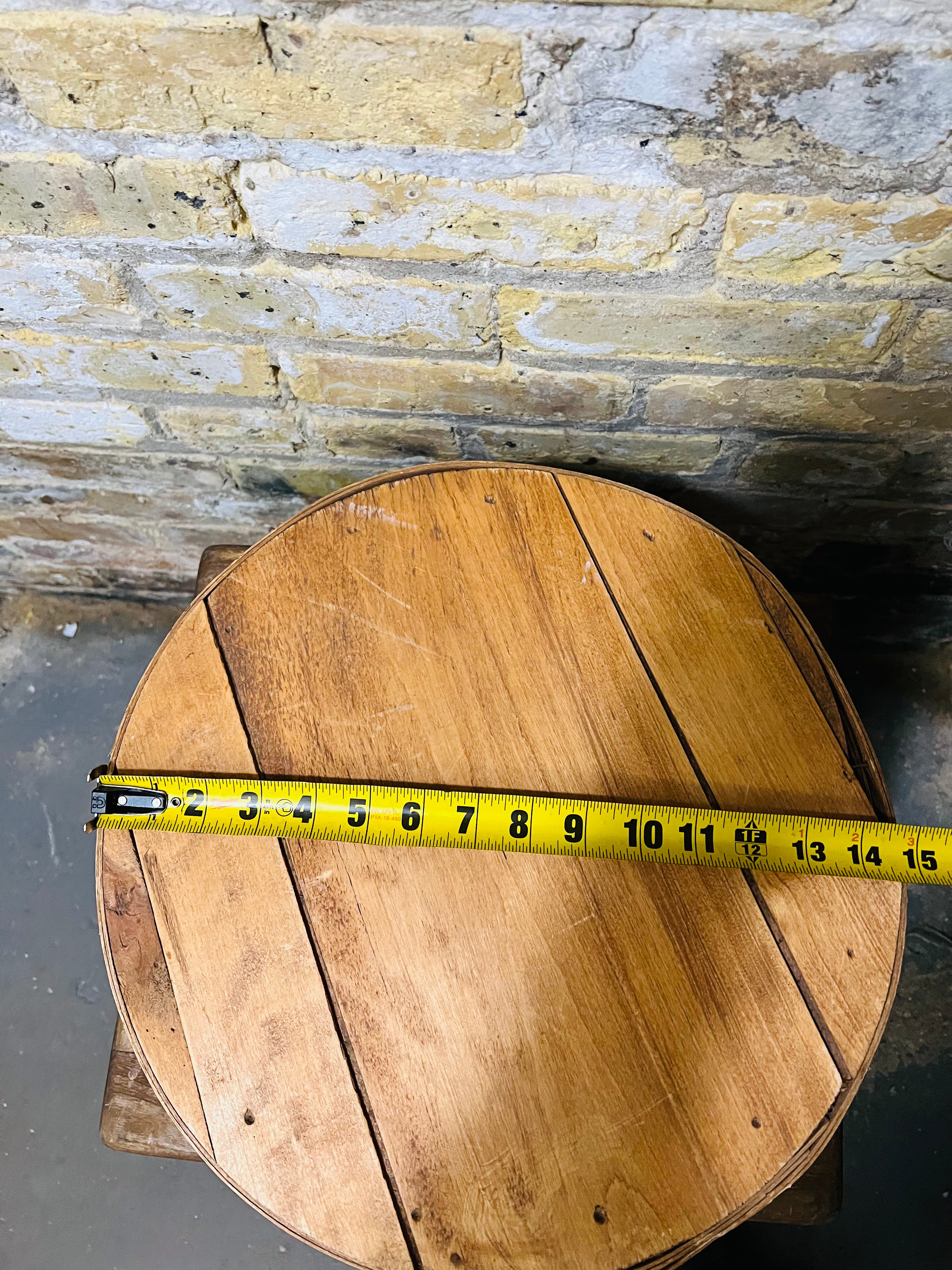 Vintage wooden cheese wheel storage box.