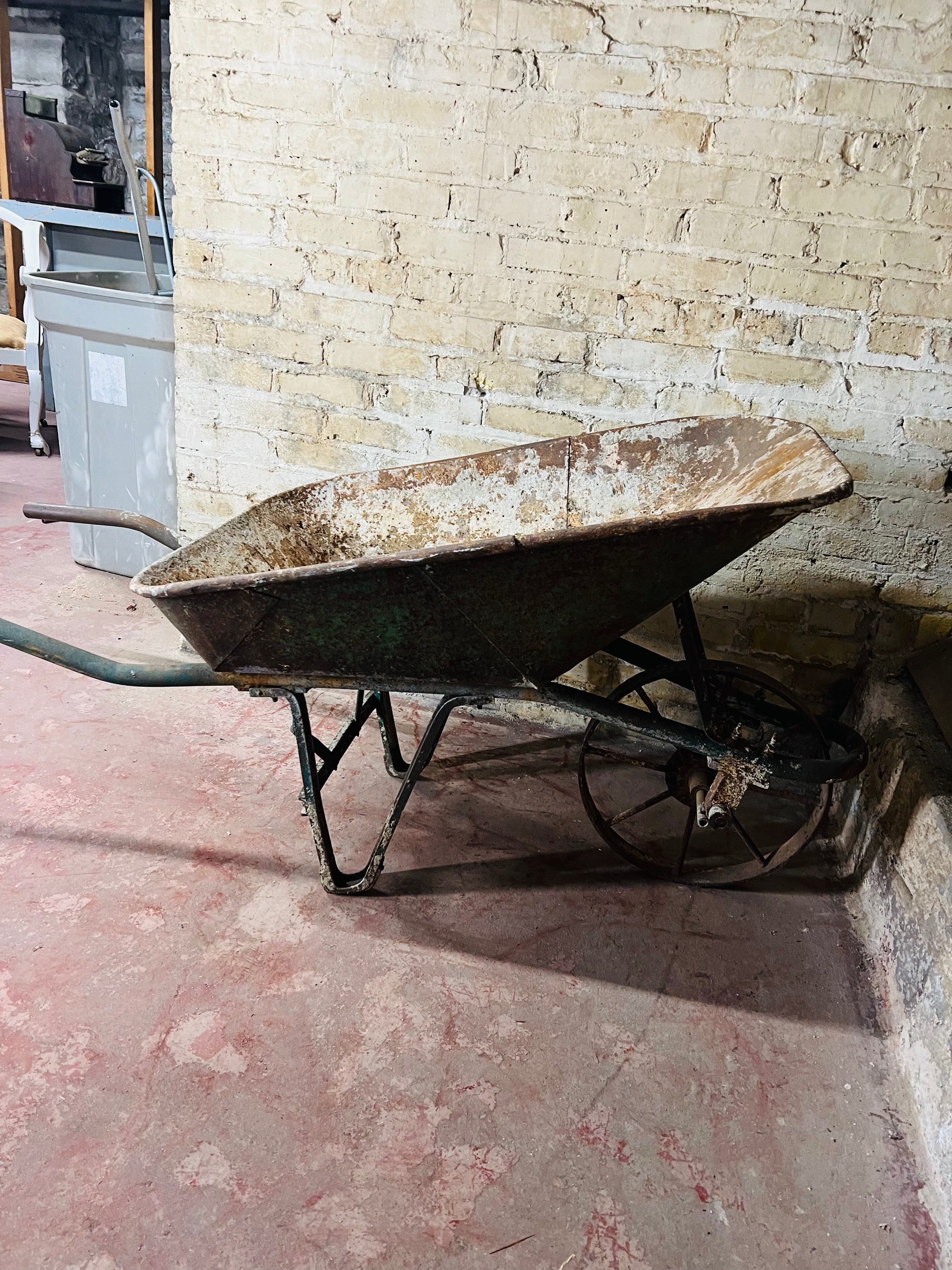 Vintage all metal wheelbarrow.