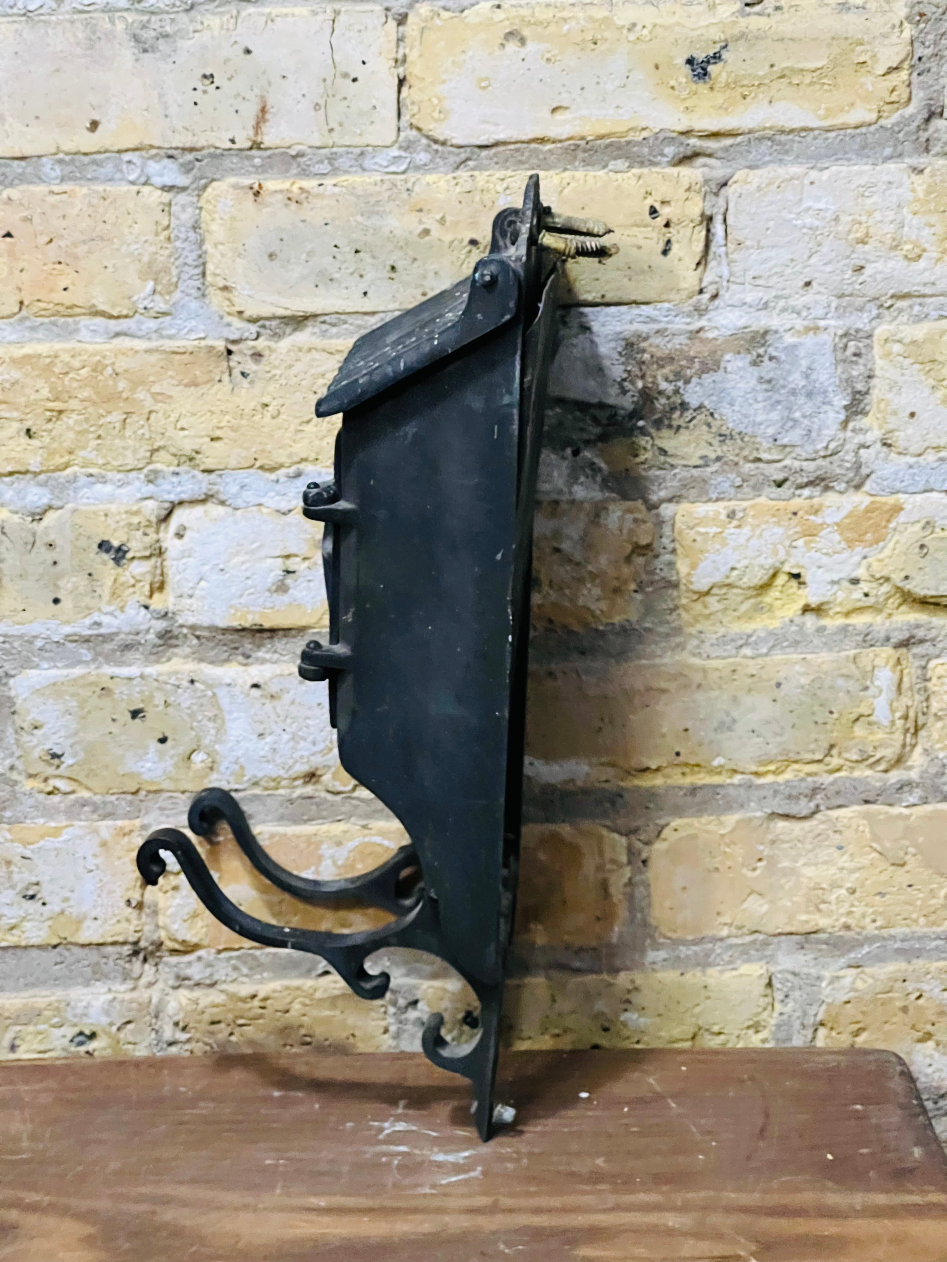 Vintage iron mailbox turn of the century era.