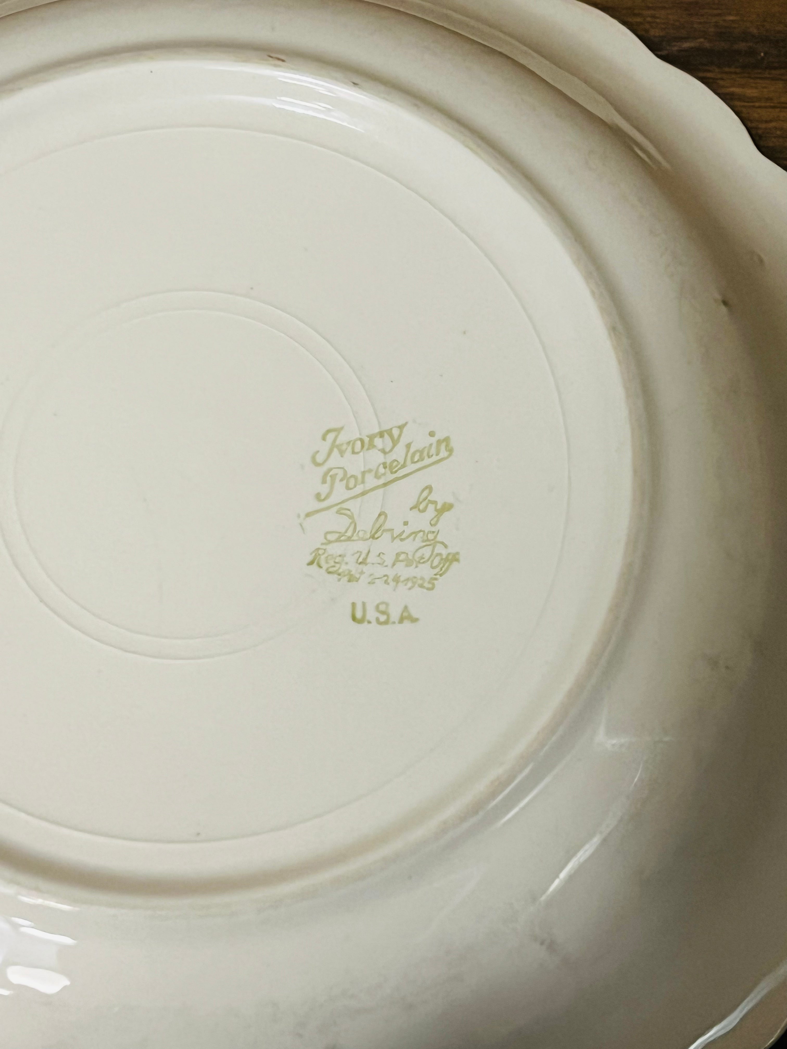 Vintage Sebring ivory porcelain bowl colored flower design.