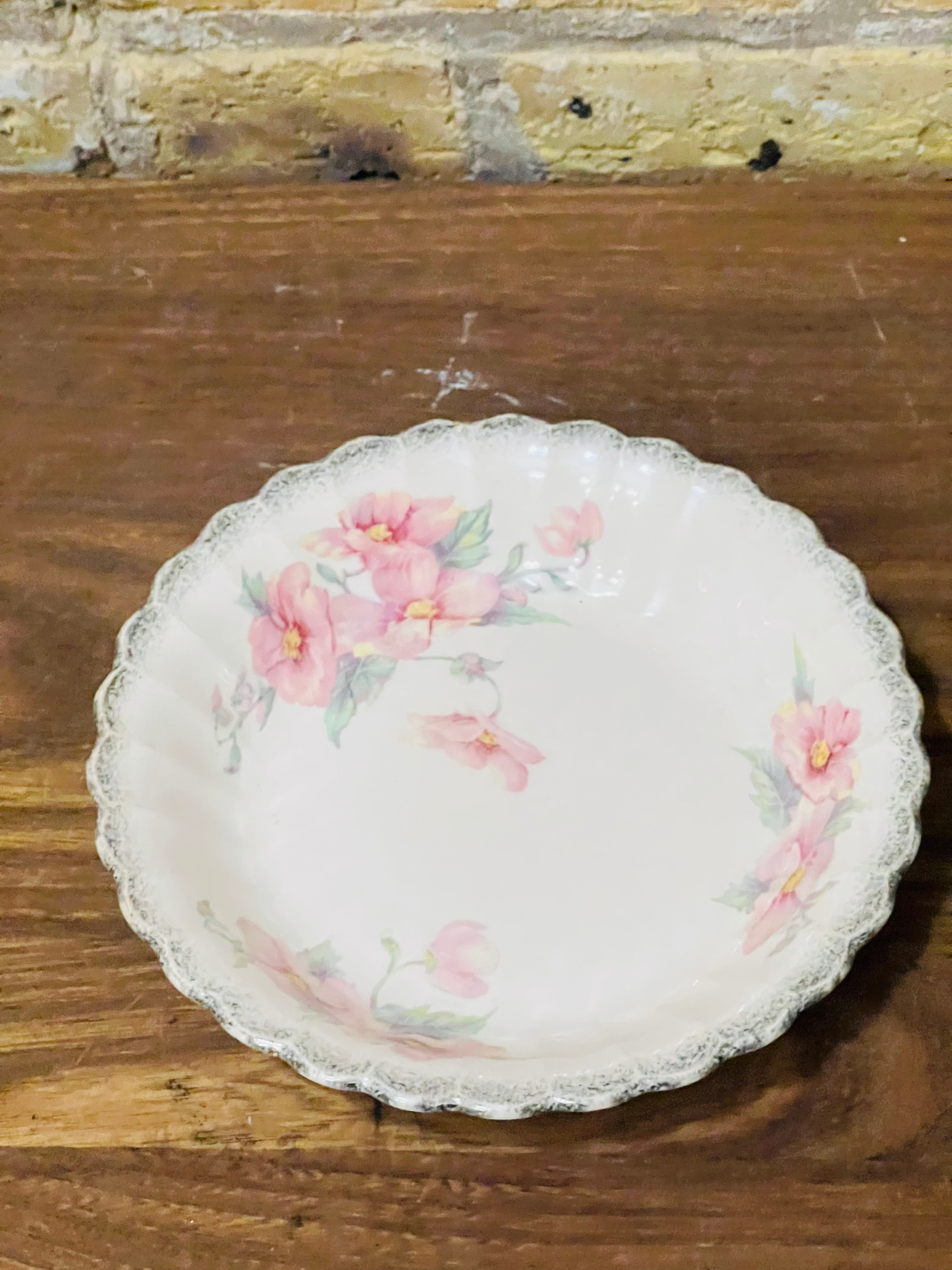 Vintage Sebring ivory porcelain bowl colored flower design.