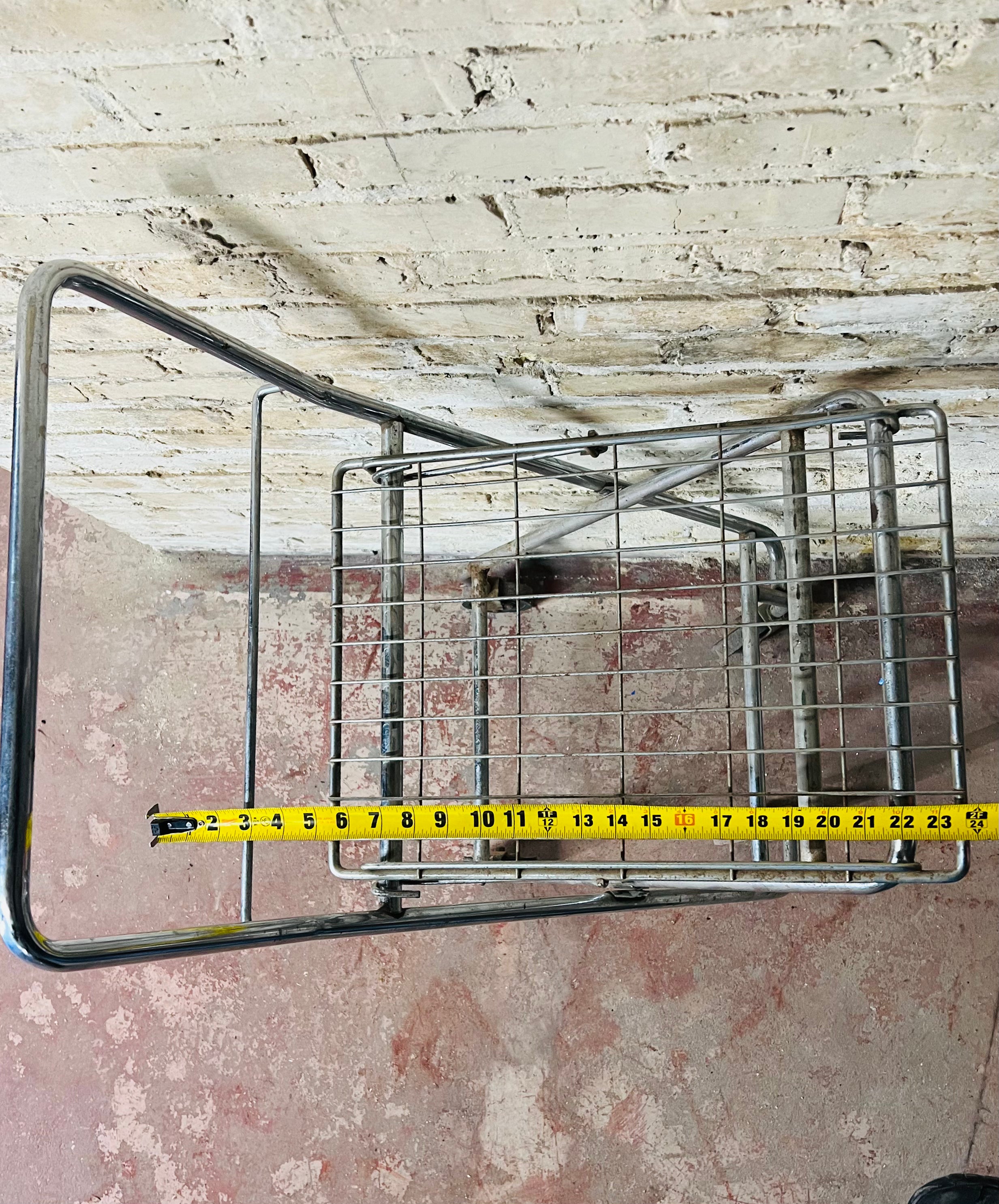 Vintage metal folding cart with wheels.