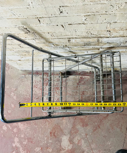 Vintage metal folding cart with wheels.