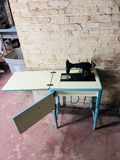 Vintage Kenmore sewing machine with antique cabinet. Good working order.