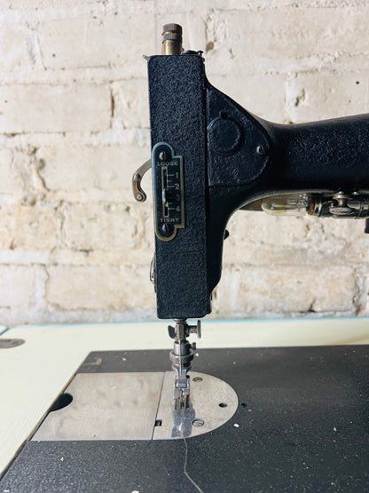 Vintage Kenmore sewing machine with antique cabinet. Good working order.