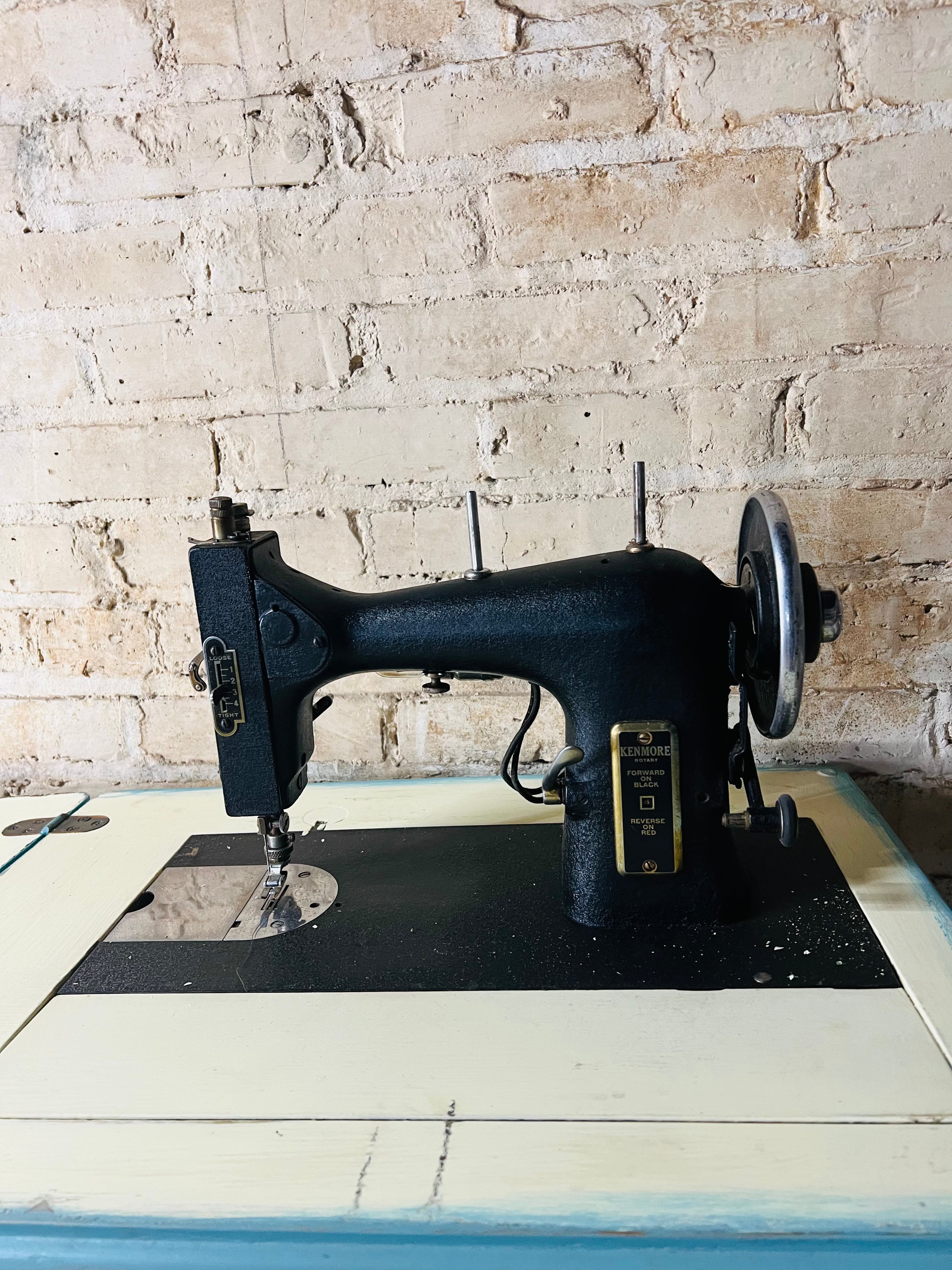 Vintage Kenmore sewing machine with antique cabinet. Good working order.