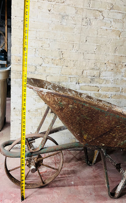 Vintage all metal wheelbarrow.