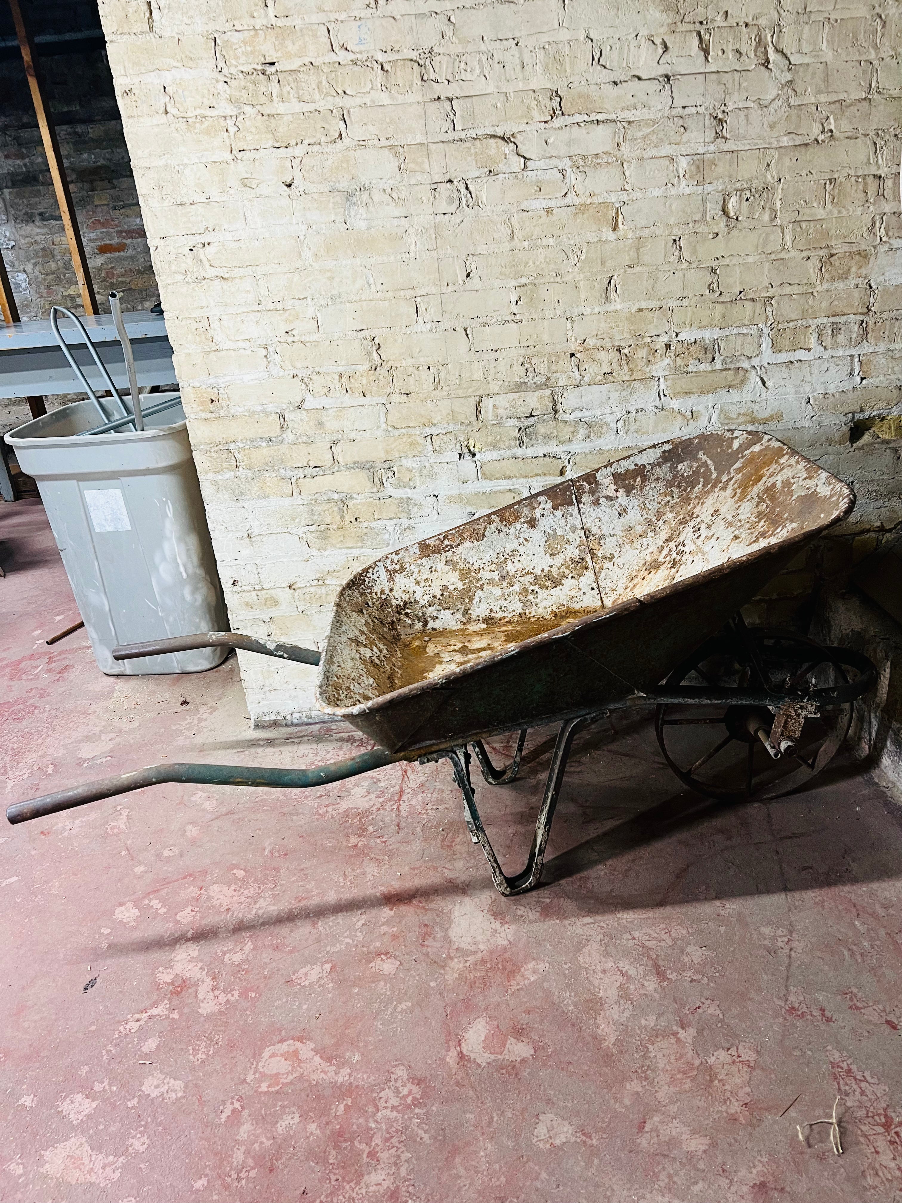 Vintage all metal wheelbarrow.
