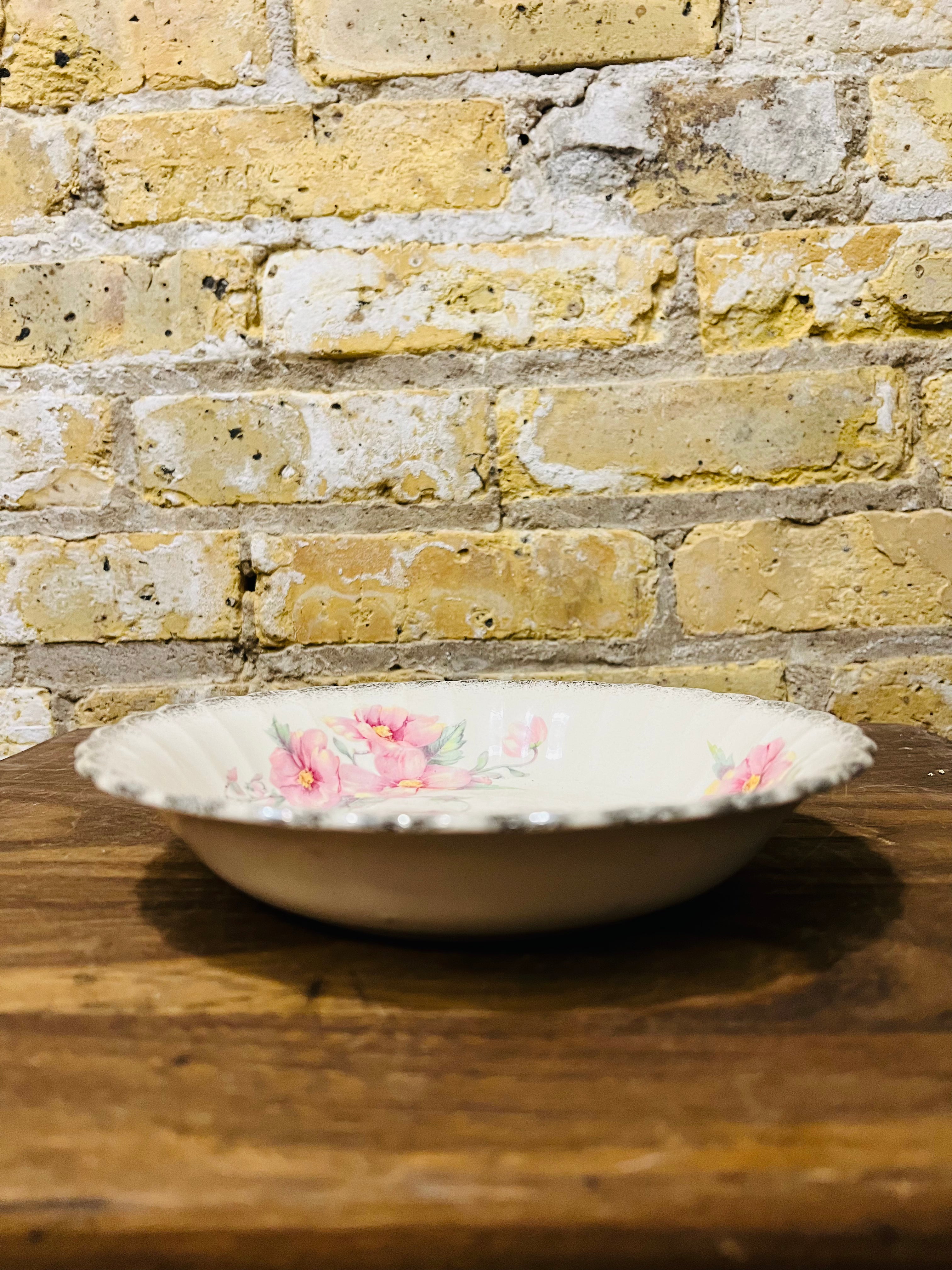 Vintage Sebring ivory porcelain bowl colored flower design.