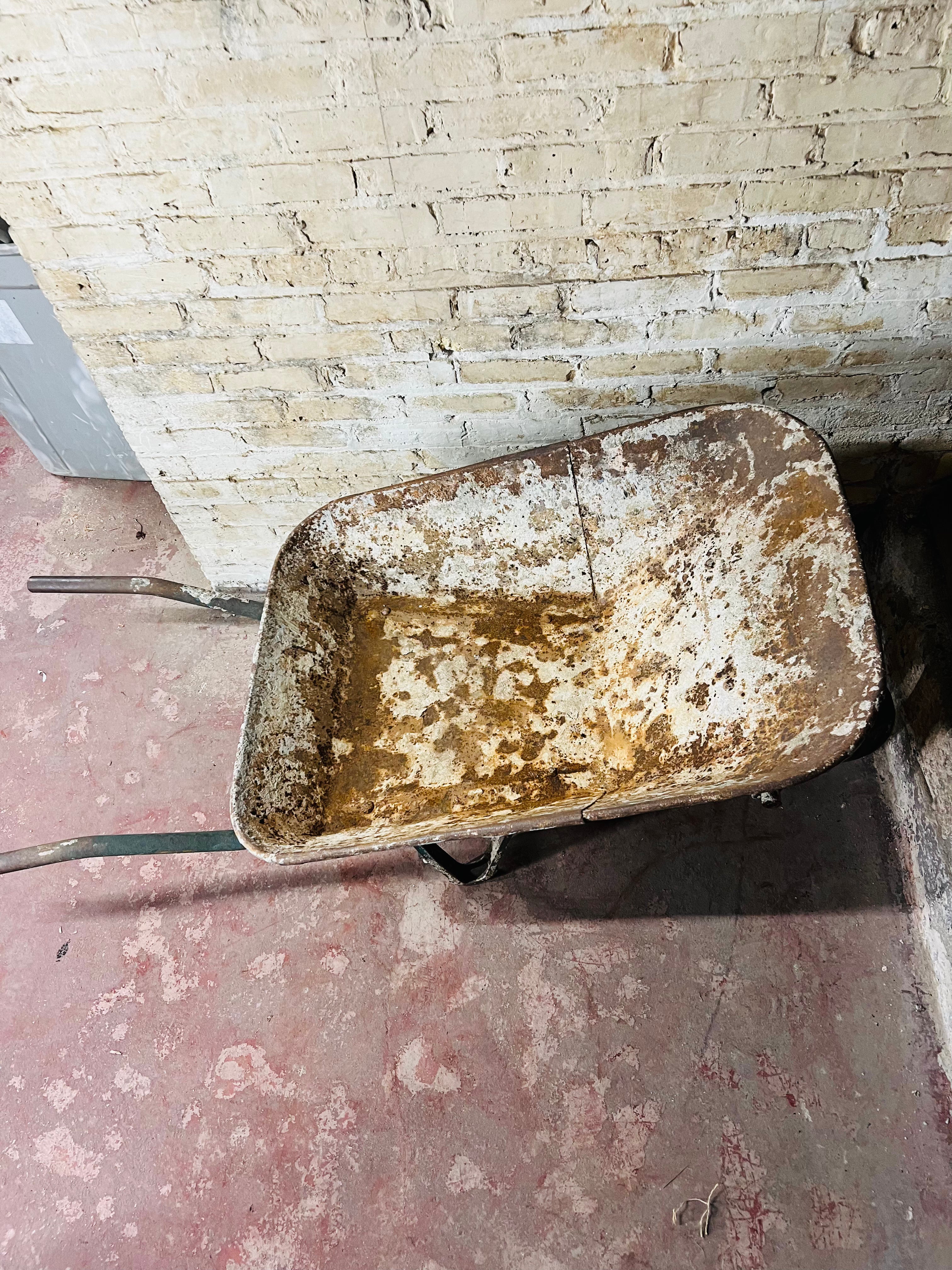 Vintage all metal wheelbarrow.