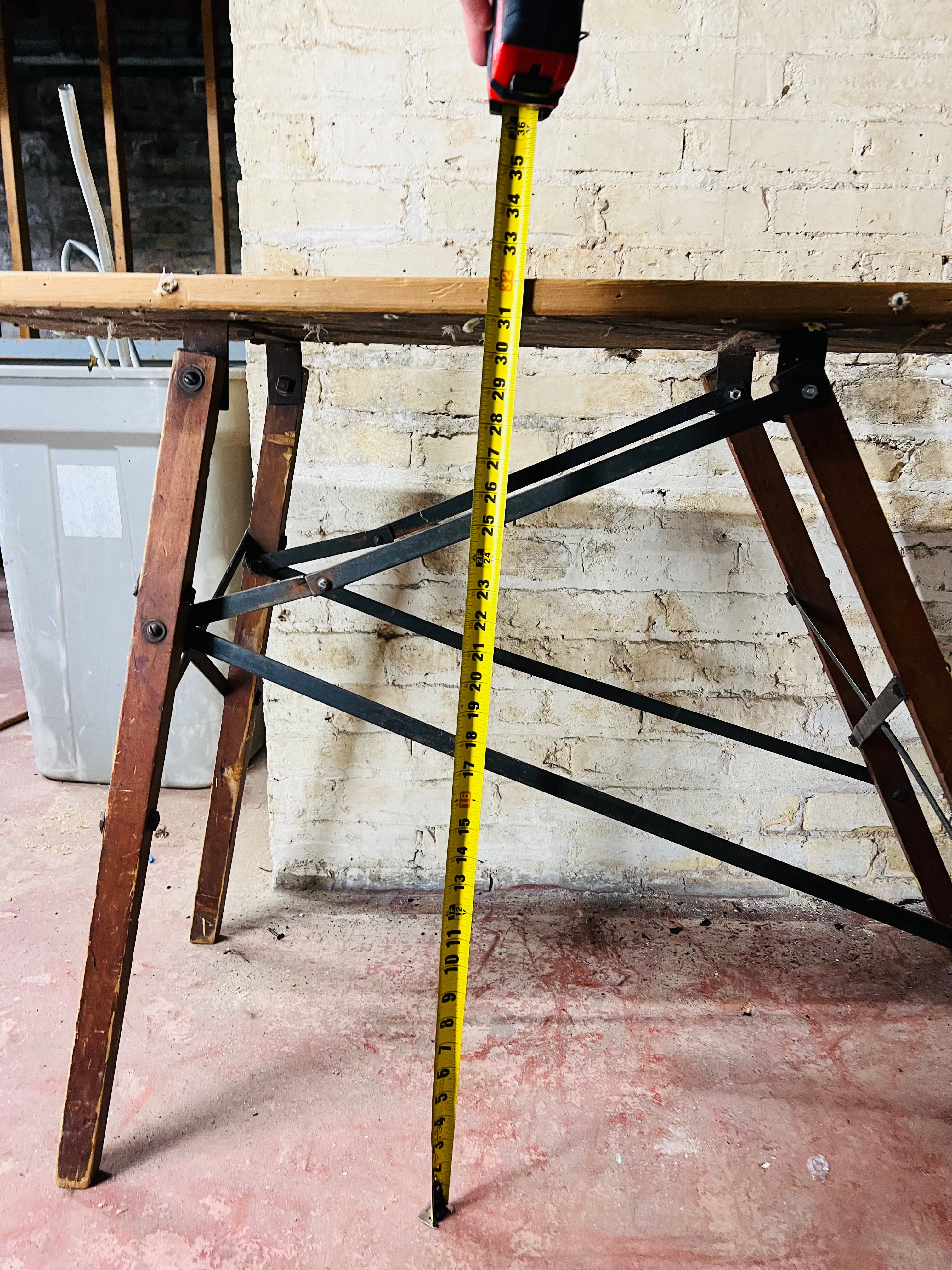 Vintage wooden folding ironing board.