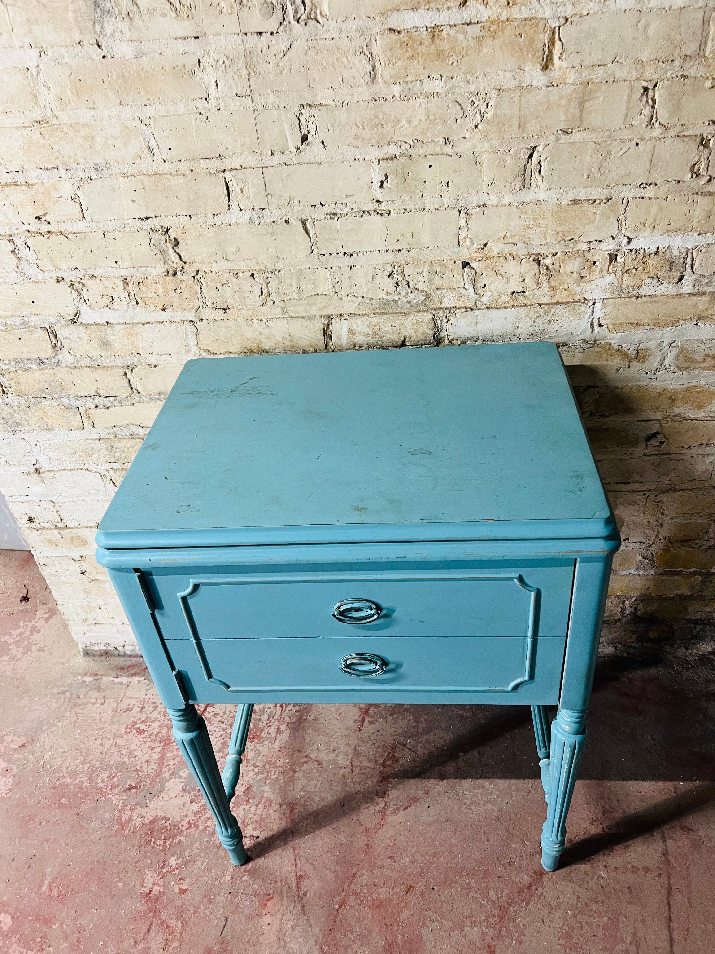 Vintage Kenmore sewing machine with antique cabinet. Good working order.