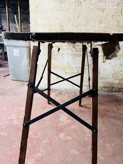 Vintage wooden folding ironing board.