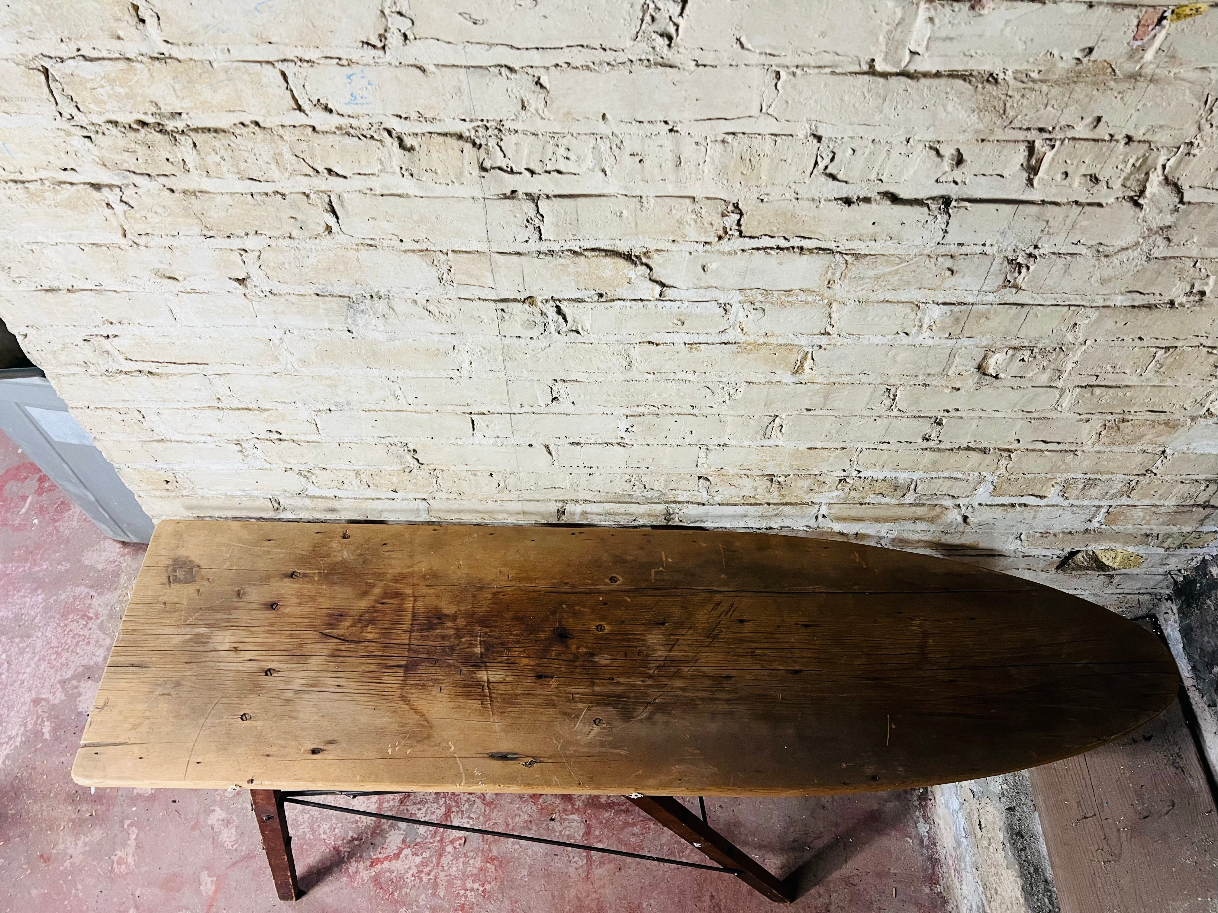 Vintage wooden folding ironing board.