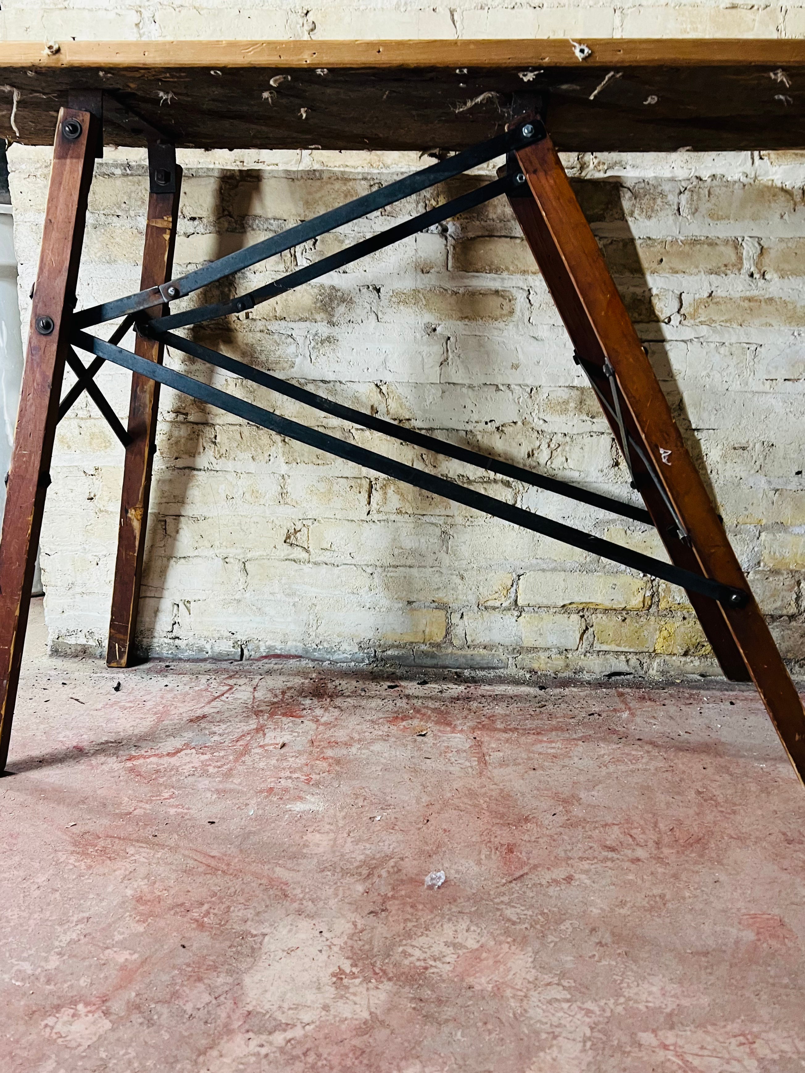 Vintage wooden folding ironing board.