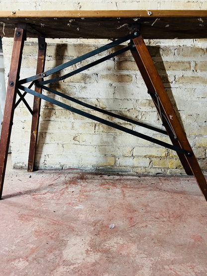 Vintage wooden folding ironing board.
