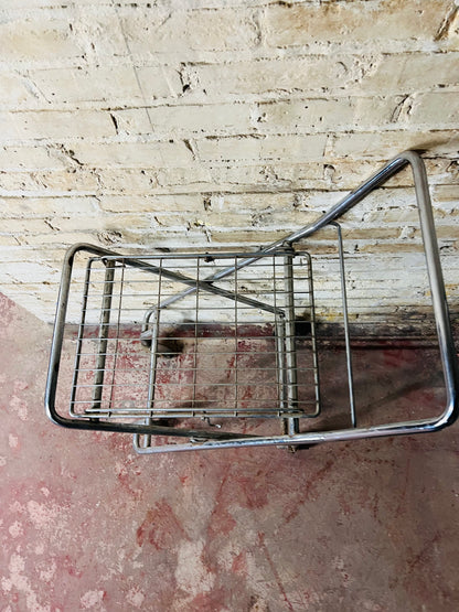 Vintage metal folding cart with wheels.