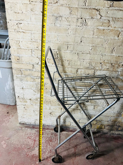 Vintage metal folding cart with wheels.