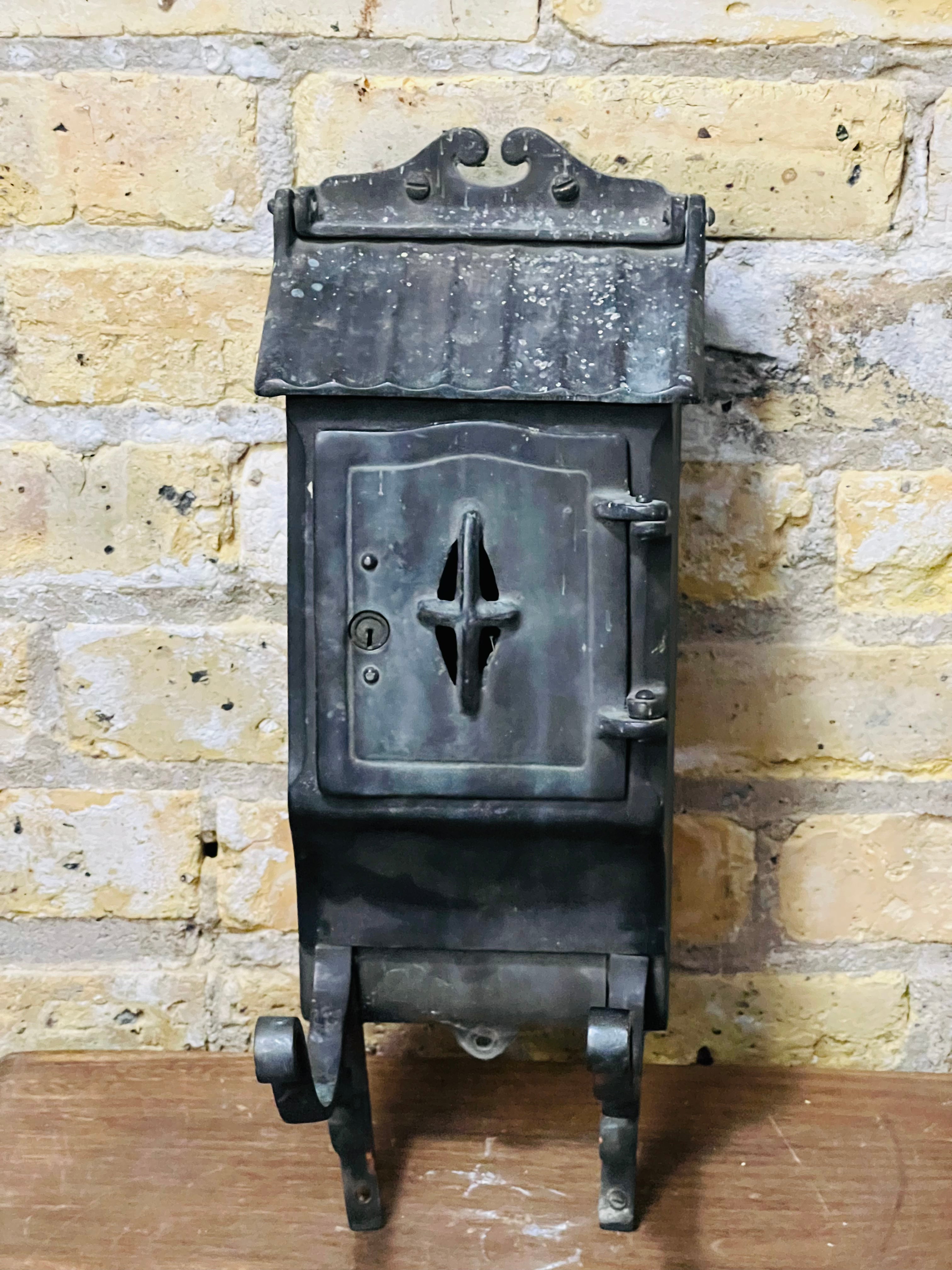 Vintage iron mailbox turn of the century era.