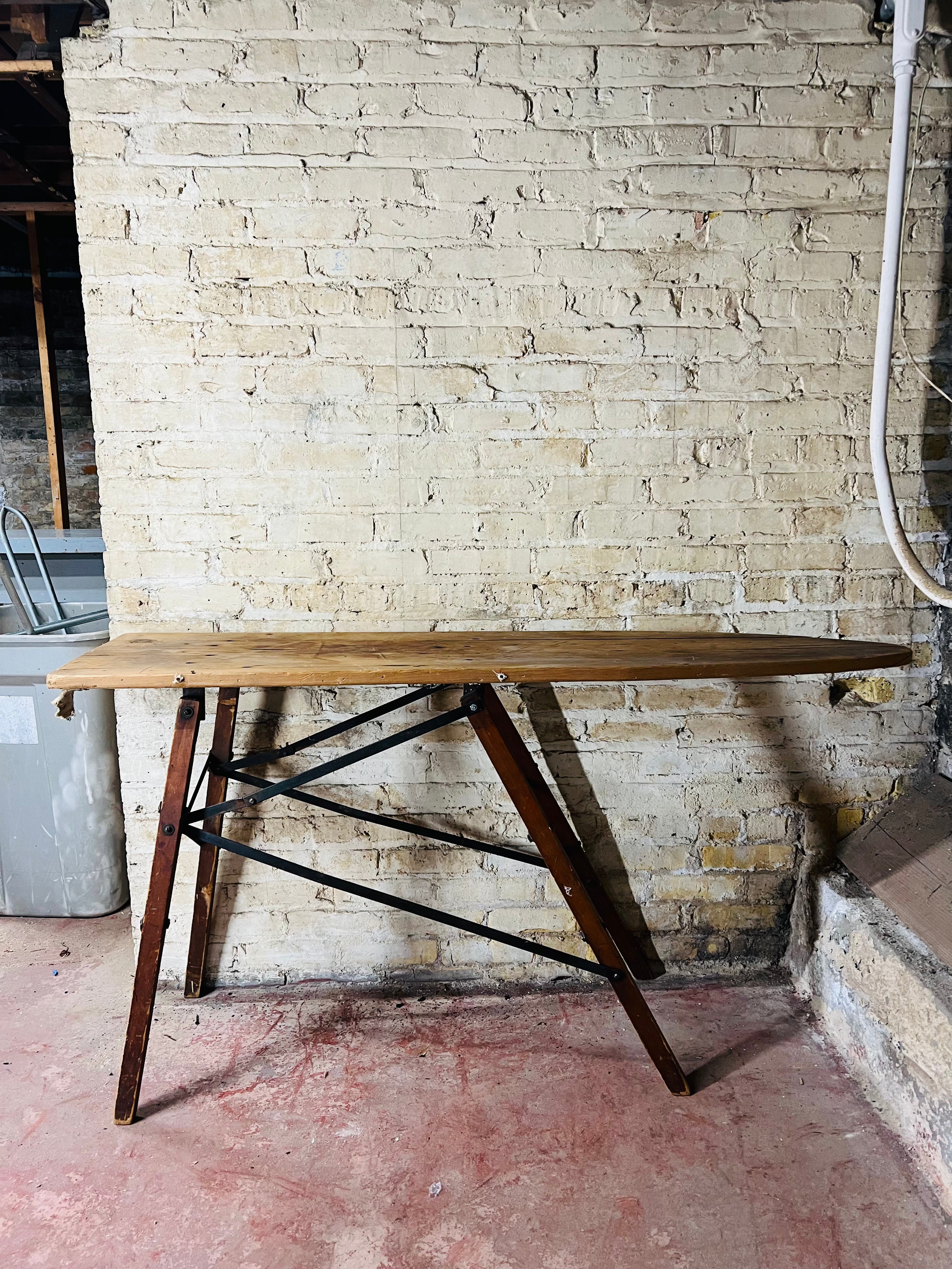Vintage wooden folding ironing board.
