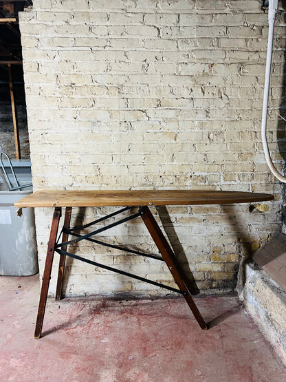 Vintage wooden folding ironing board.