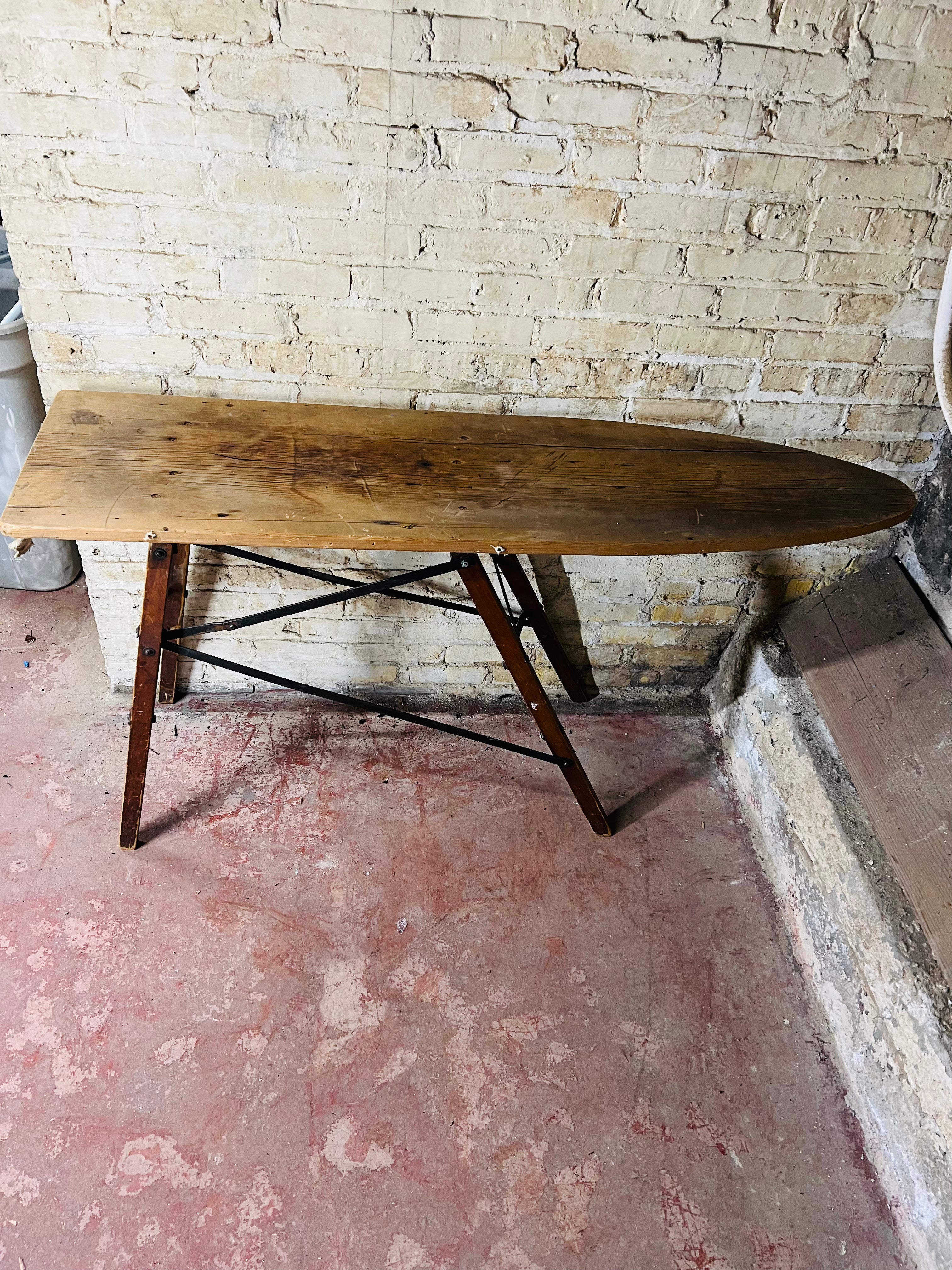Vintage wooden folding ironing board.
