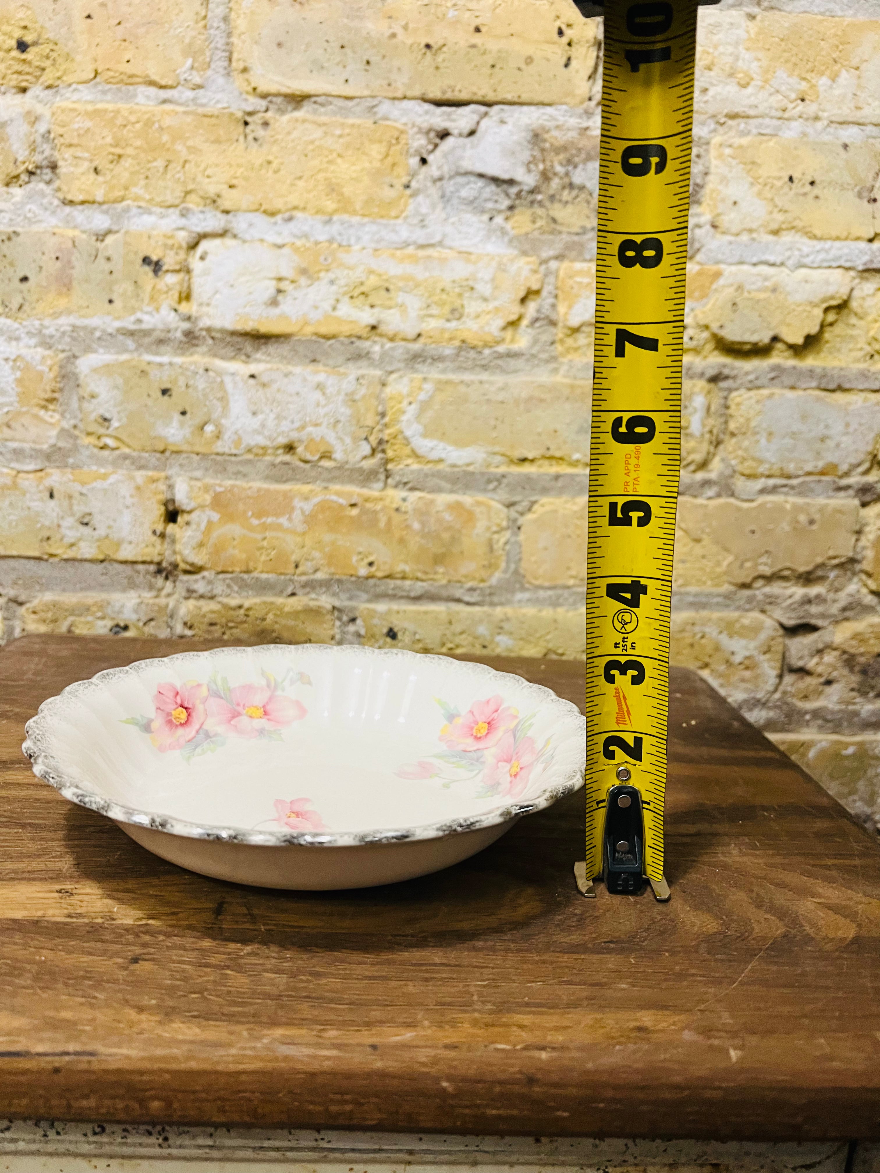 Vintage Sebring ivory porcelain bowl colored flower design.