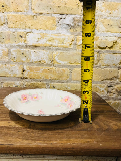 Vintage Sebring ivory porcelain bowl colored flower design.