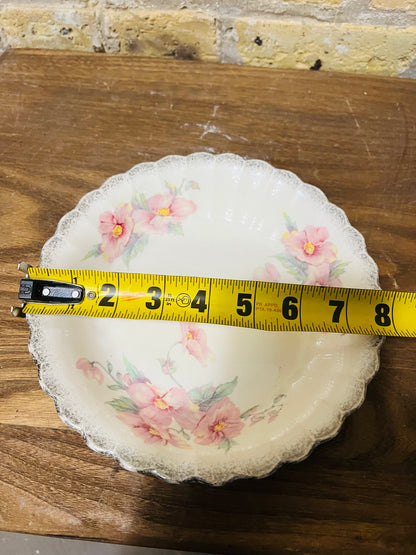 Vintage Sebring ivory porcelain bowl colored flower design.