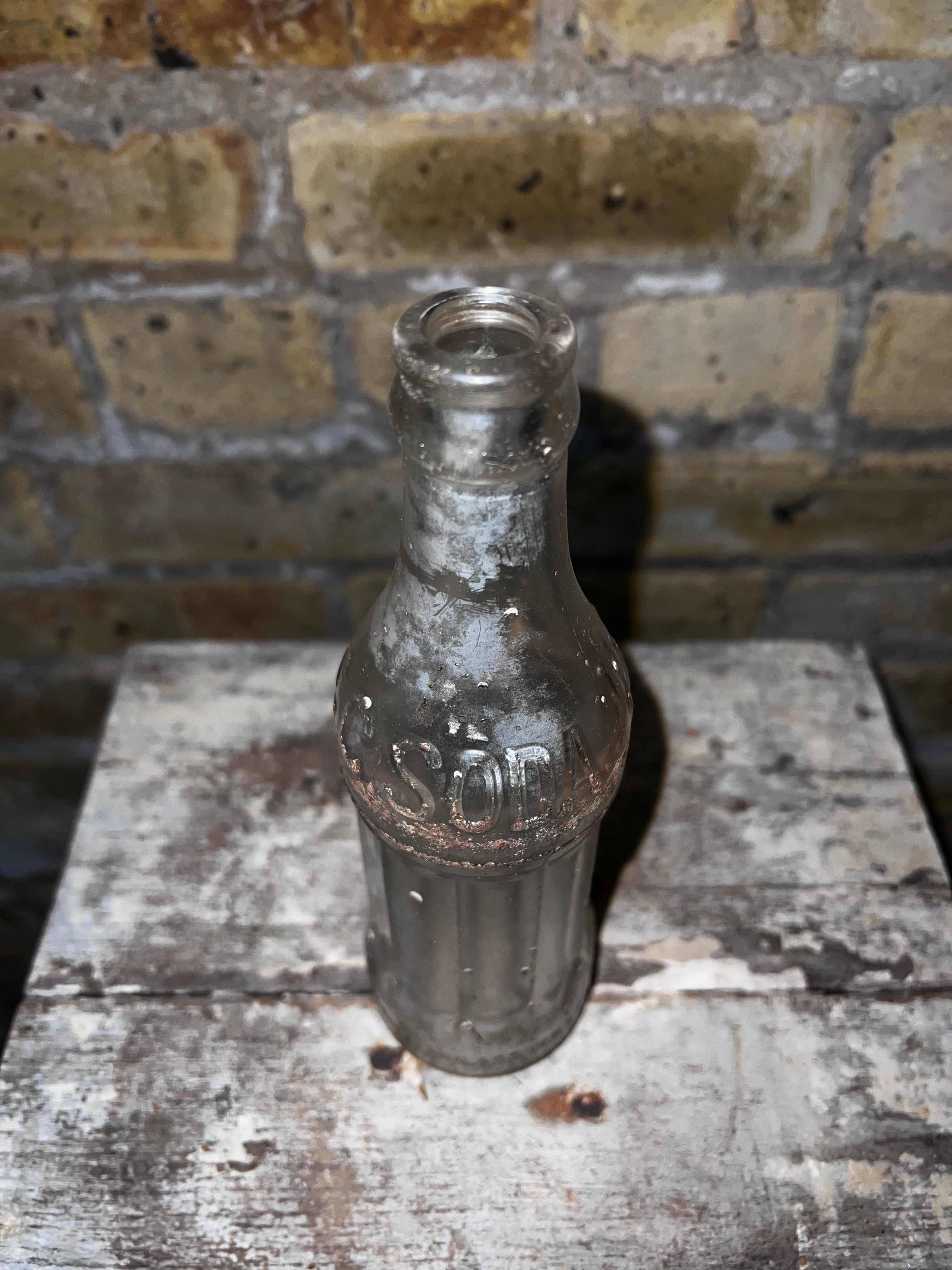 Clear Glass Soda Bottle