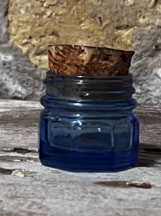 Miniature blue glass jar with cork lid