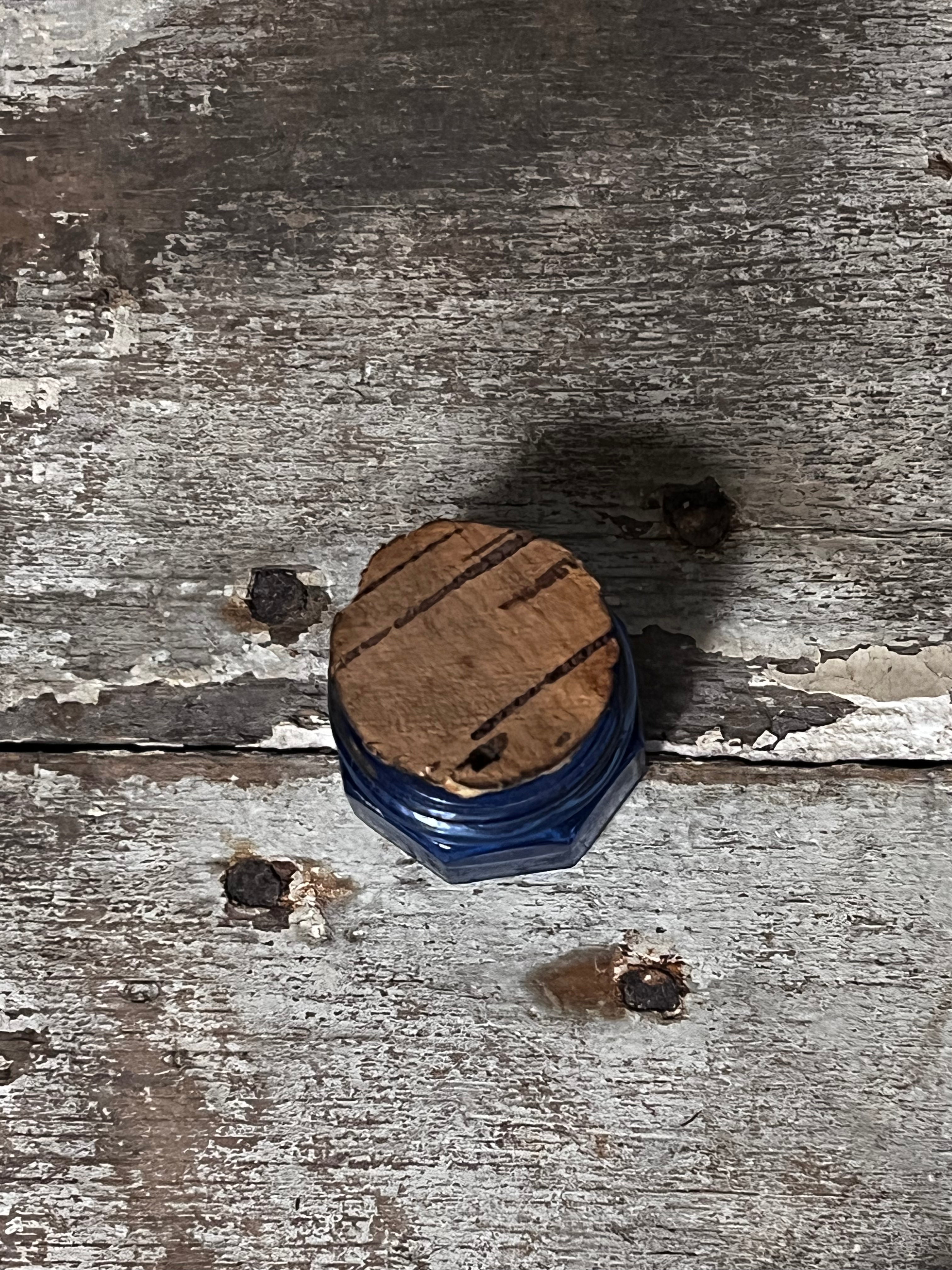 Miniature blue glass jar with cork lid